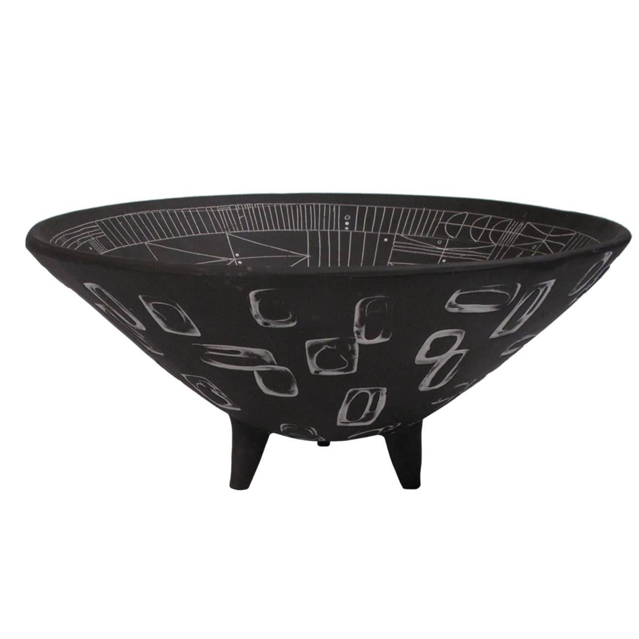 A large incised black and white “Scribe” ceramic bowl by LA artist Heather Rosenman. Individually carved, so no two are alike. Decorative purpose only. Signed by the artist.