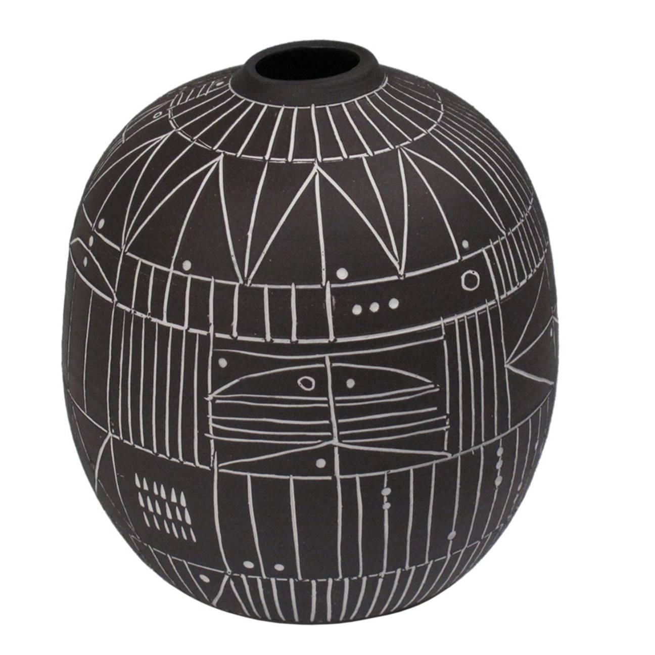 A small incised black and white “Scribe” ceramic vase by LA artist Heather Rosenman. Individually carved, so no two are alike. Sealed on the interior and thus suitable for functional use. Signed by the artist.