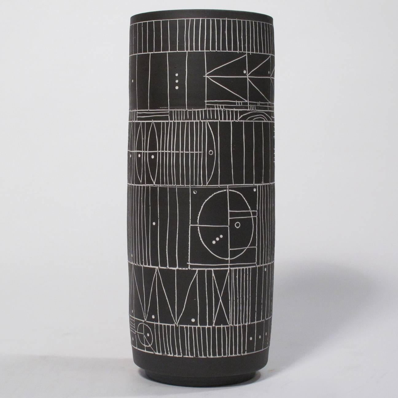 A trio of incised black and white “Scribe” ceramic cylinder vases by LA artist Heather Rosenman. Individually carved, so no two are alike. Sealed on the interior and thus suitable for functional use. Signed by the artist. Can be purchased