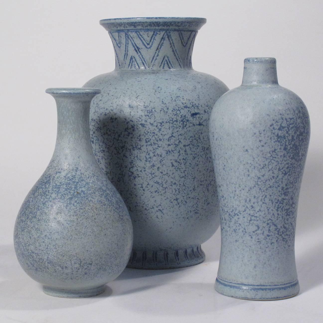 A beautiful grouping of Gunnar Nylund ceramic vases for Rorstrand with a stunning light blue haresfur glaze. Maker’s mark and signature on bottom. Can be purchased individually.

Measures: Left: 3.75" diameter x 5.75" height