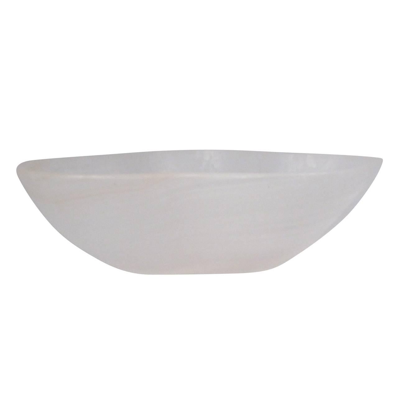 A small undulating white onyx bowl.
