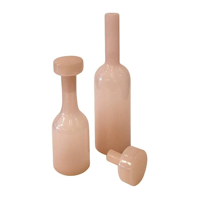 A pair of soft pink Art Deco apothecary glass bottles. Sold as a set.
Measure: Small 2.5?D x 8?H
Large 2.75?D x 12?H.