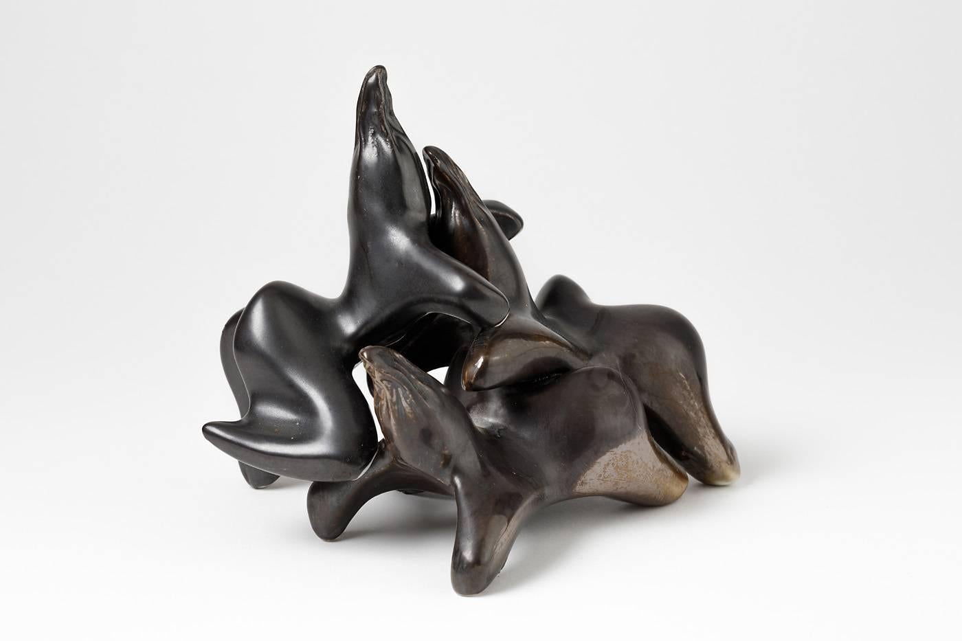 Exceptional sculpture which represents three animals by the French artist Tim Orr.

Beautiful black ceramic glaze.

circa 1970.

 