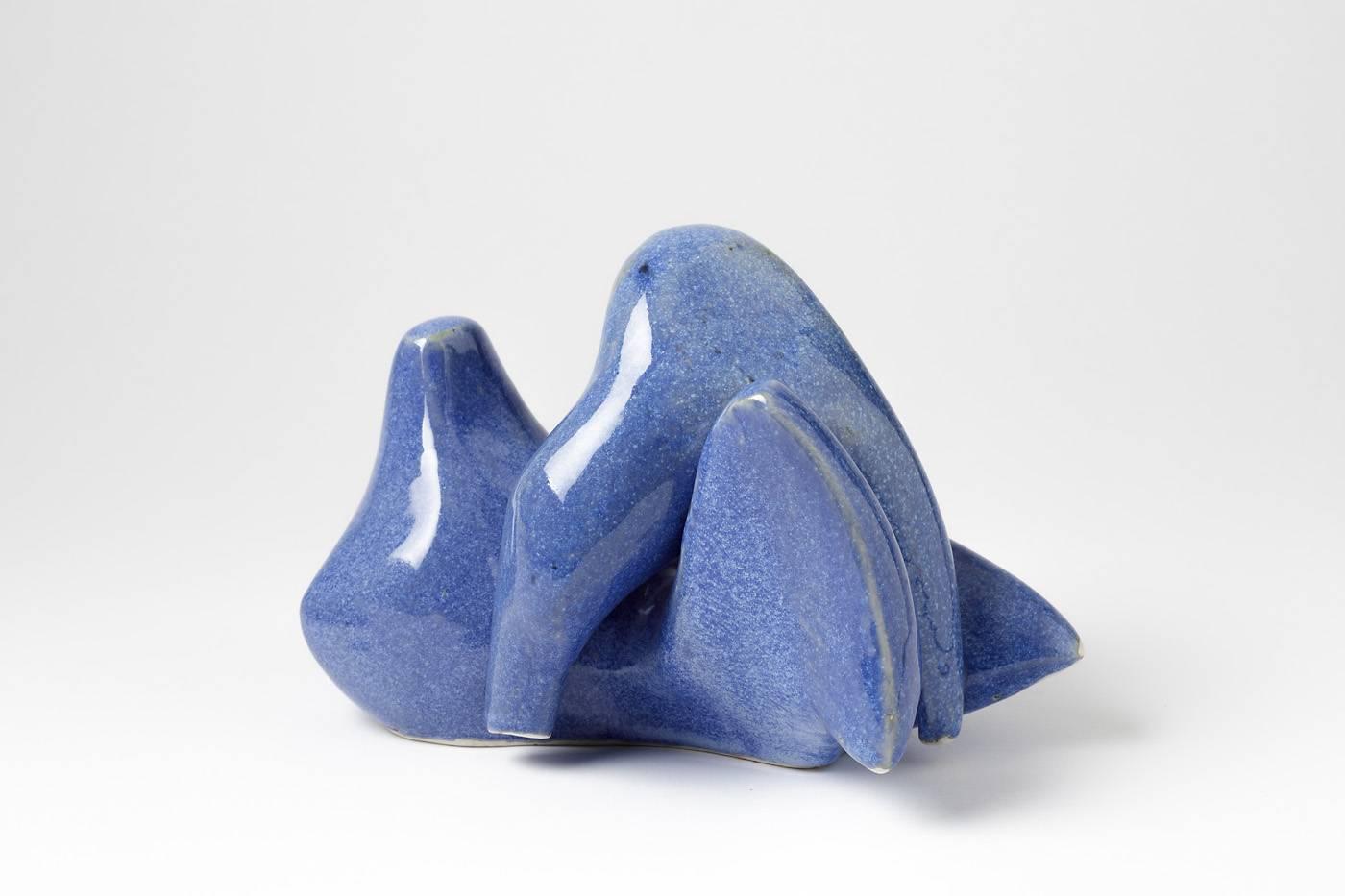 Elegant porcelain sculpture by Tim Orr.

Beautiful blue glaze ceramic, 

circa 1970, signed under the base.