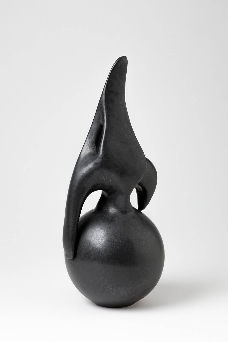 Elegant abstract sculpture by Tim Orr.

Porcelain sculpture with beautiful black ceramic glaze.

Signed under the base, circa 1970.