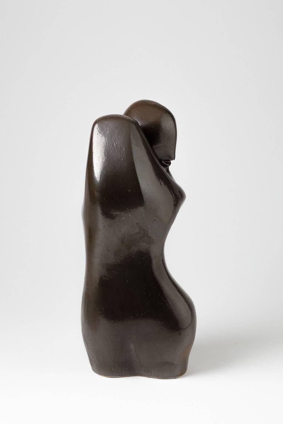 Figurative sculpture by Tim Orr.

Porcelain form with beautiful black ceramic glaze.

circa 1970, signed under the base.



