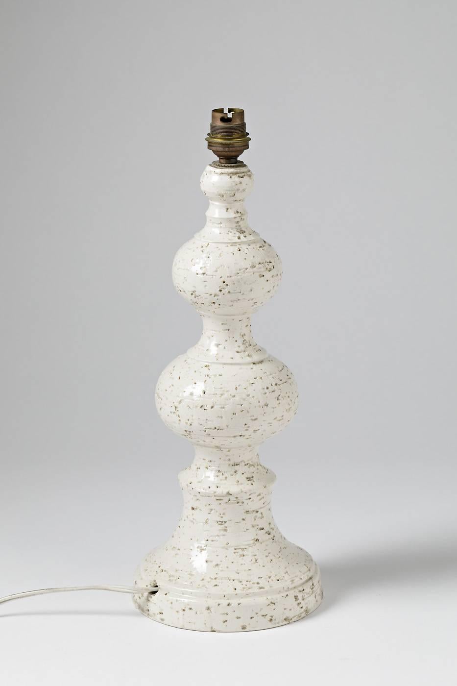 Elegant French ceramic lamp, circa 1970.

Beautiful white glaze.

Perfect original condition.

Sold without lampshade.