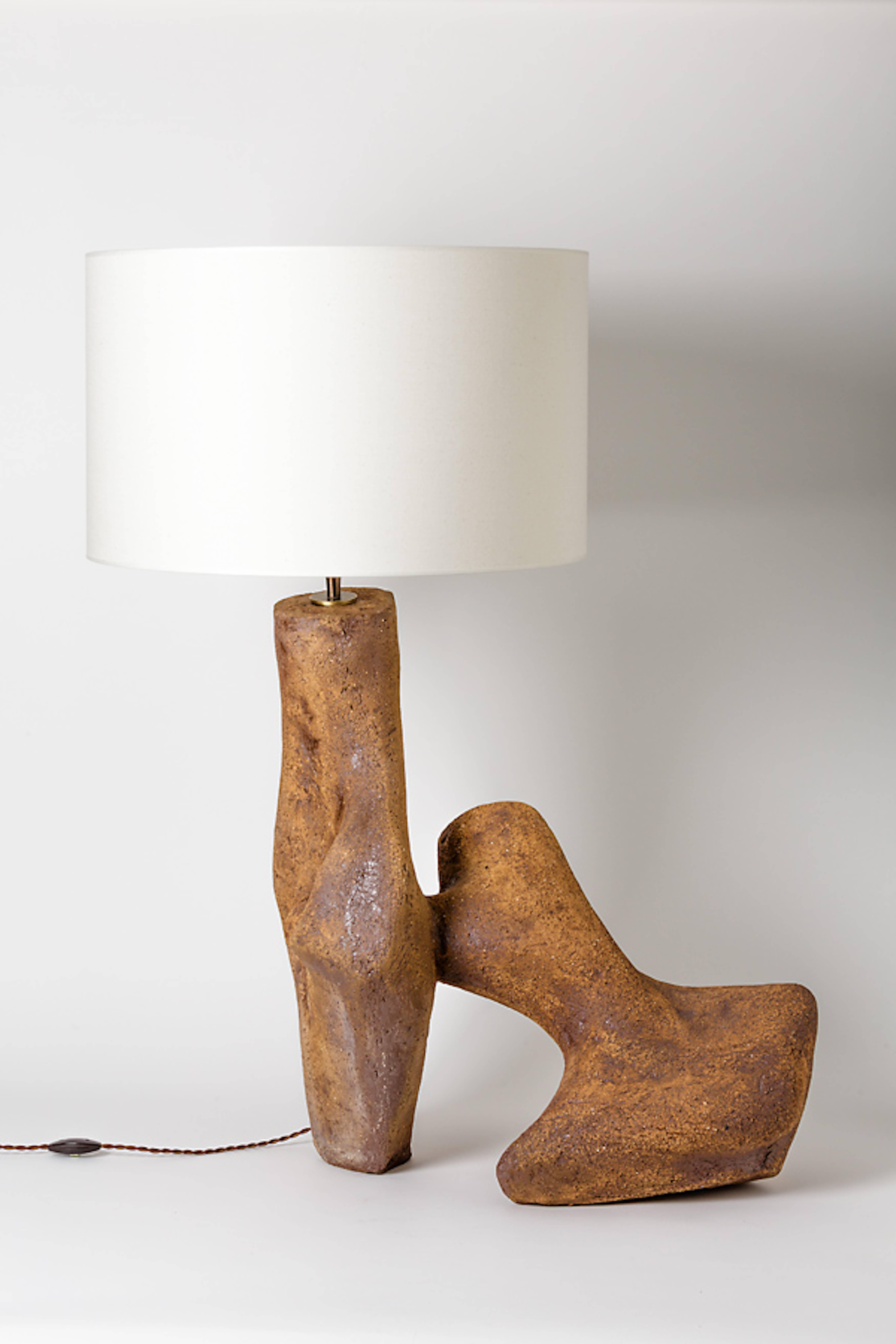 An exceptional and important ceramic lamp by Tim Orr.
Signed at the base.
Unique piece.
Sold with new electrical system and lampshade,
circa 1970.

Height with lampshade: 36' inch.
Height without lampshade: 27'1/2 inch.
Height without