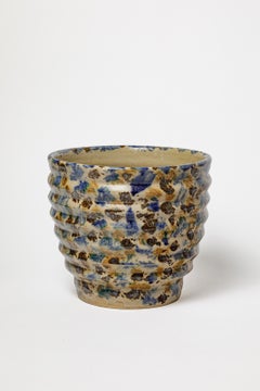Maceta o cubeta decorativa de cerámica de estilo art déco del siglo XX, en tonos azules y marrones, de Lucien Talbot