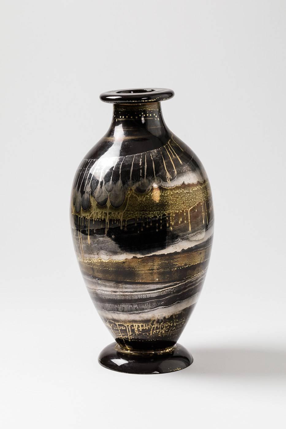 A ceramic vase with black, gold and silver glazes by Lucien Brisdoux.
Signed under the piece " Brisdoux ".
Unique piece,
circa 1970.
Perfect original conditions.
 