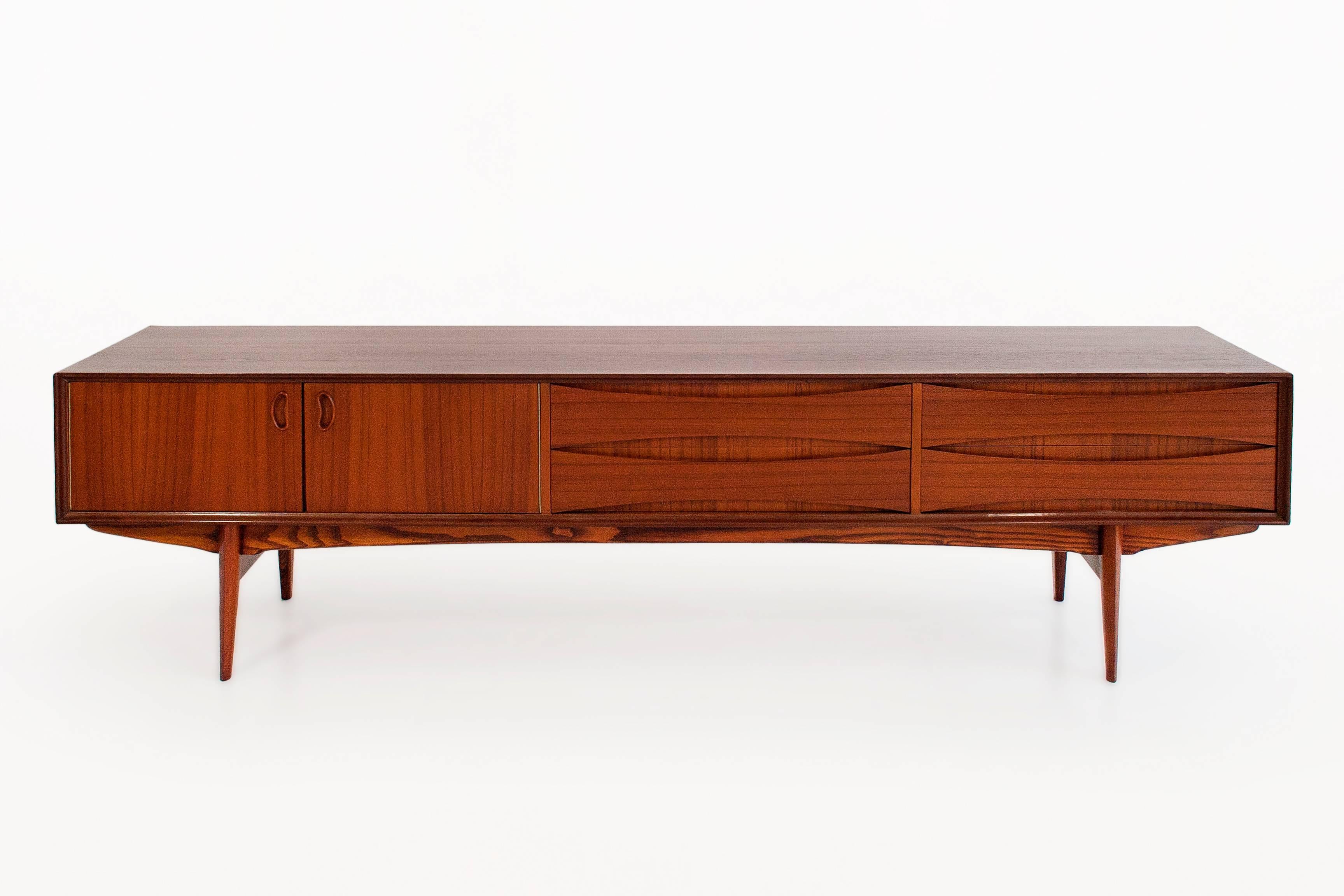 Teak sideboard by Arne Vodder
Beautiful design and proportions
Interior divided in four sections: Two doors and four drawers
circa 1960, Denmark 
Very good vintage condition.