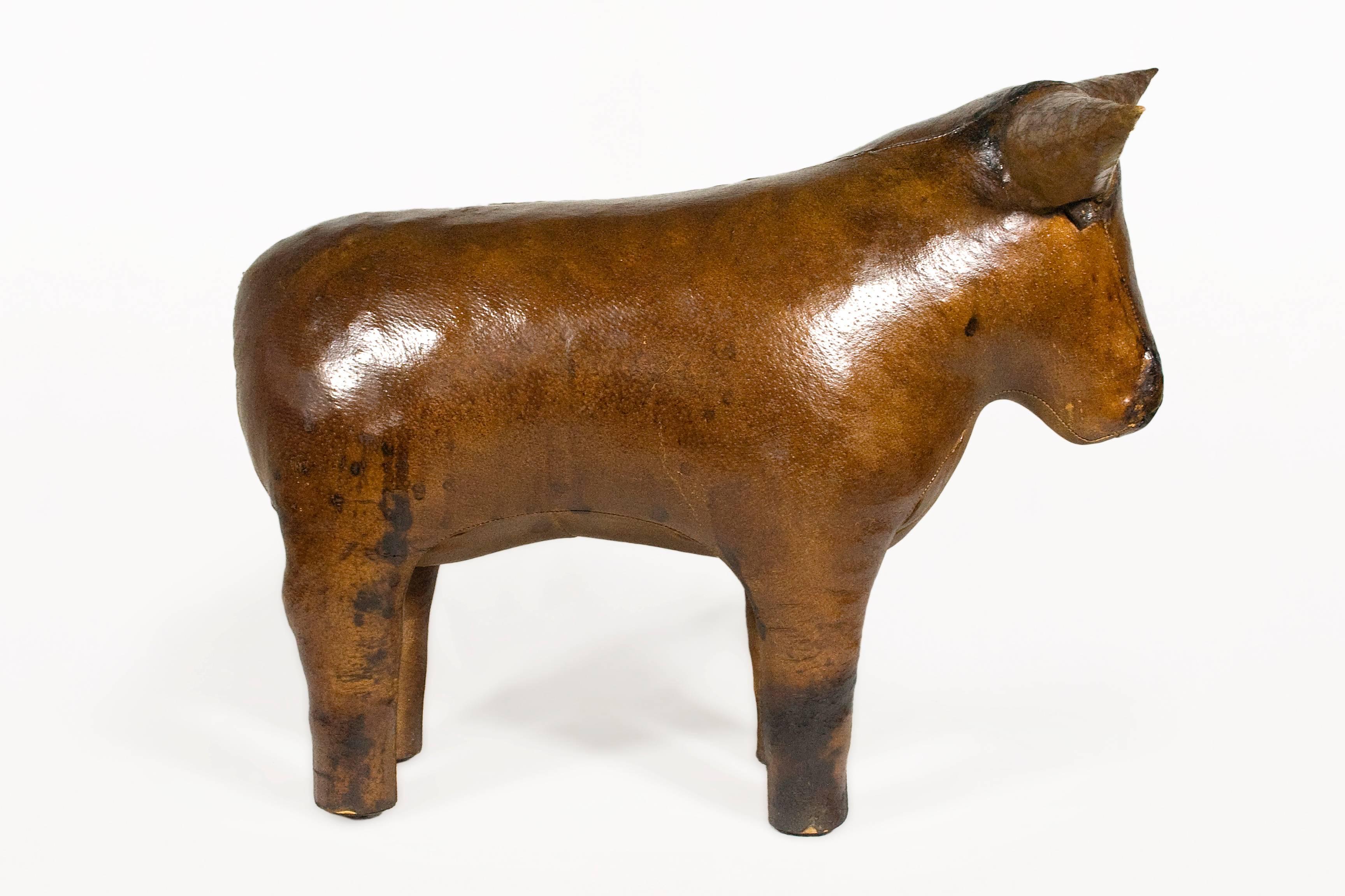 Magnificent and rare vintage Abercrombie and Fitch leather bull footstool.
Patined leather.
circa 1970, England.
Solid.
Good vintage condition.