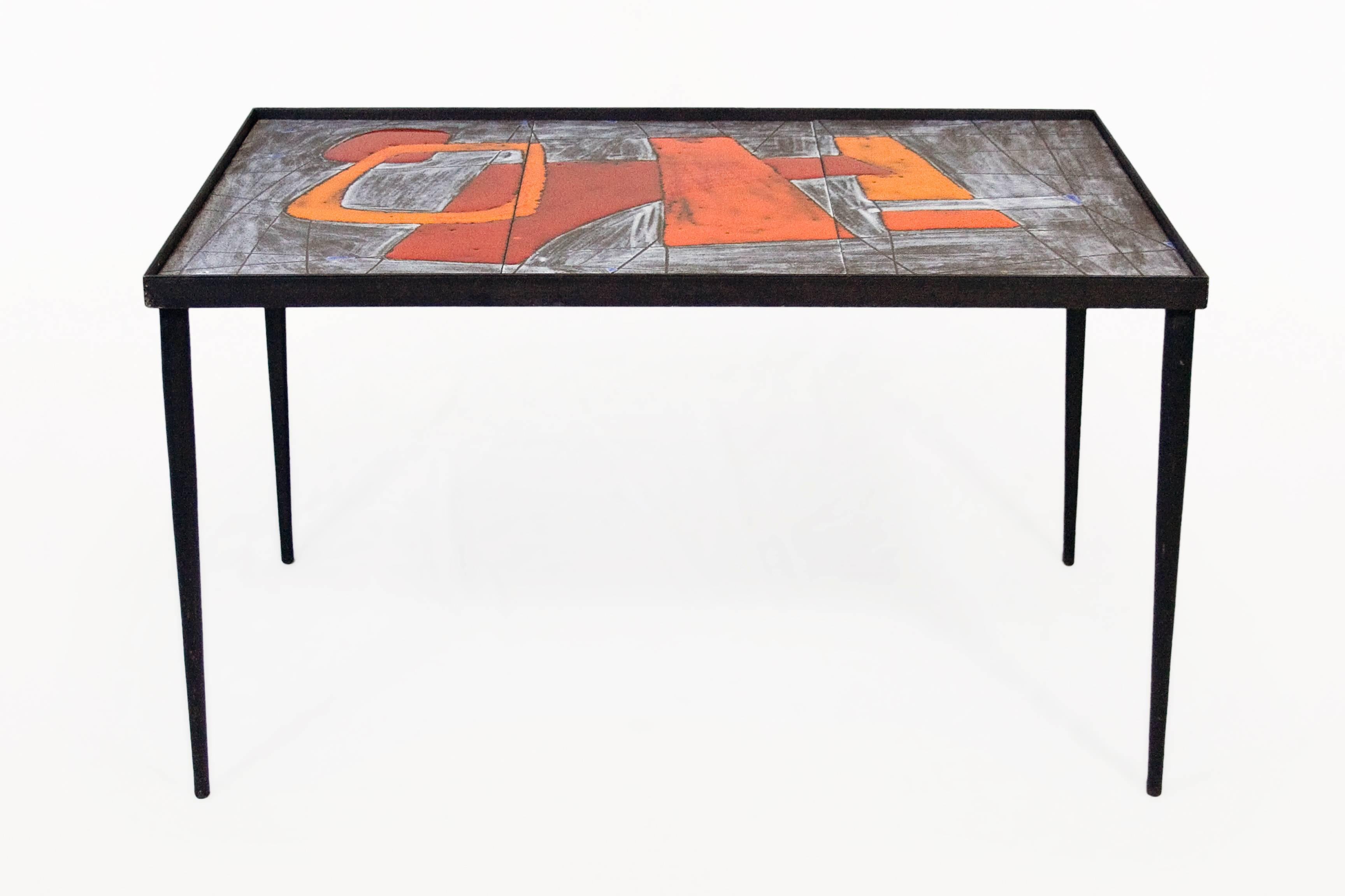 Pair of Robert and Jean Cloutier ceramic coffee tables.
Geometric forms.
Ceramic and glazed top with metal leg structure,
circa 1960, France.
Documentation: 