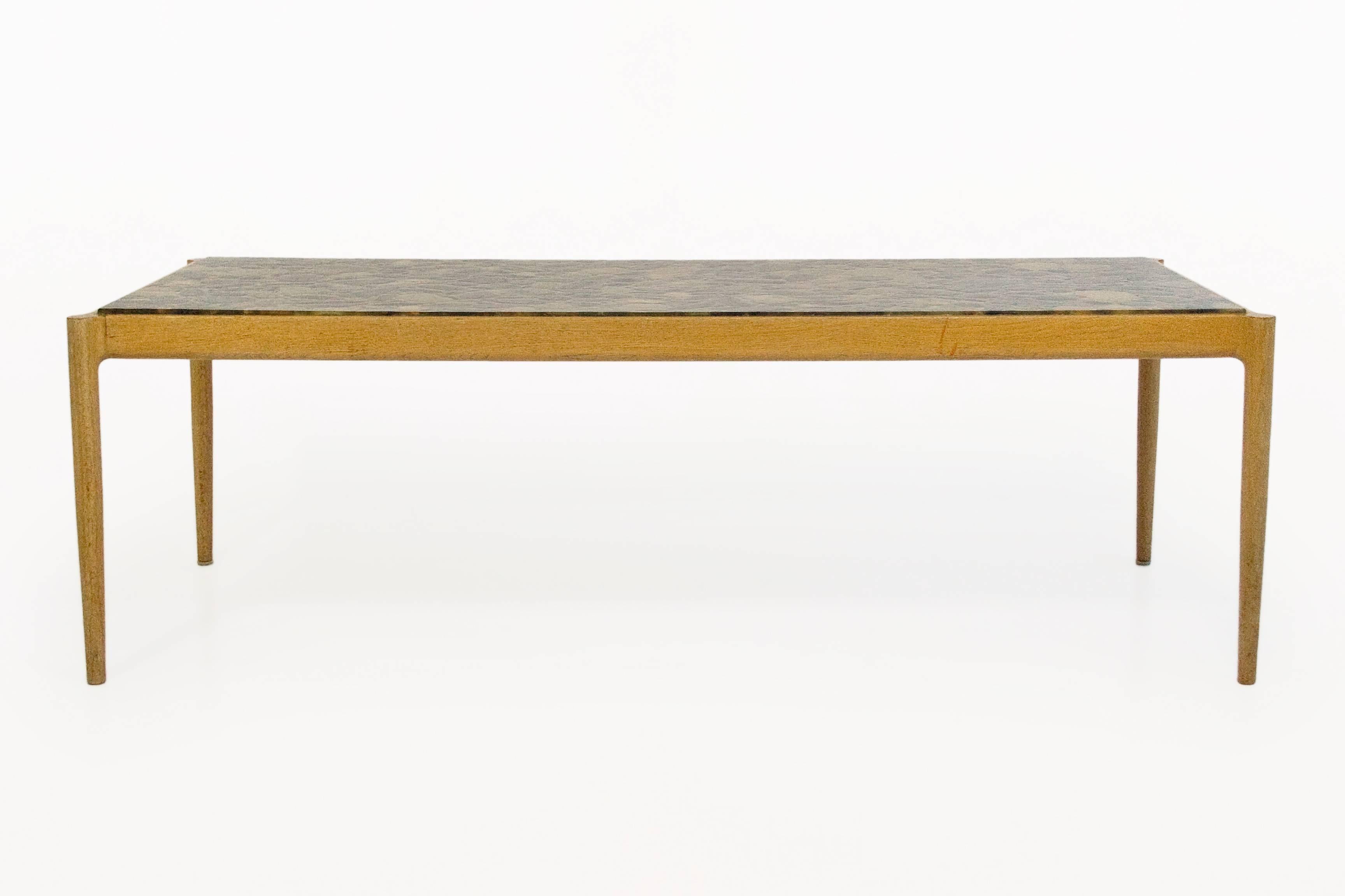 Ib Kofod-Larsen coffee table by Seffle Möbelfabrik
coffee table in elm with resin and stone top
circa 1960s, Sweden
with manufacturer's stamp
Very good vintage condition.