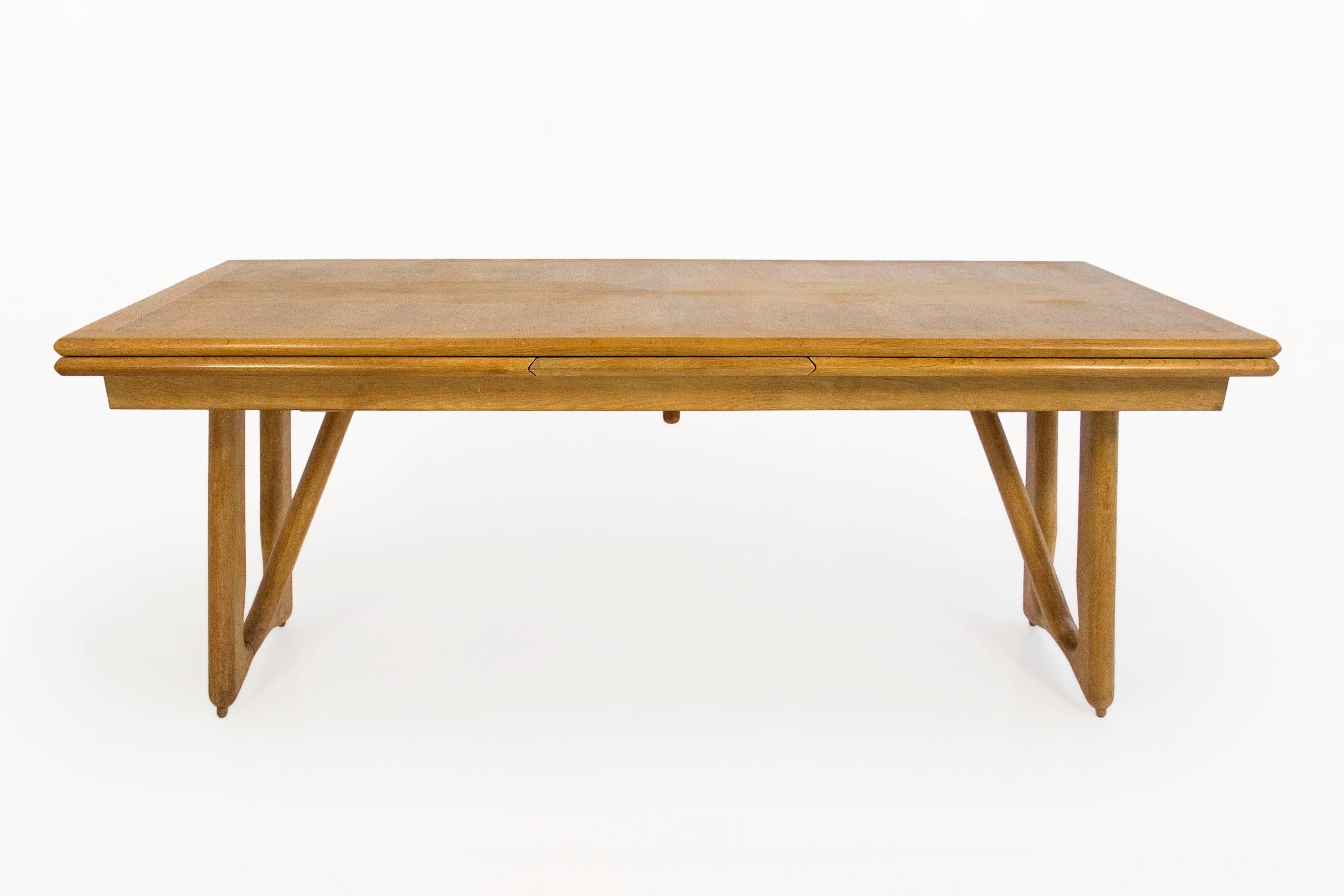 Guillerme et Chambron oak leaf extension dining table. 
Beautiful oak dining table with integrated extensions
Beautiful inlaid tabletop design
Beautiful table leg design
circa 1960, France
Very good vintage condition.