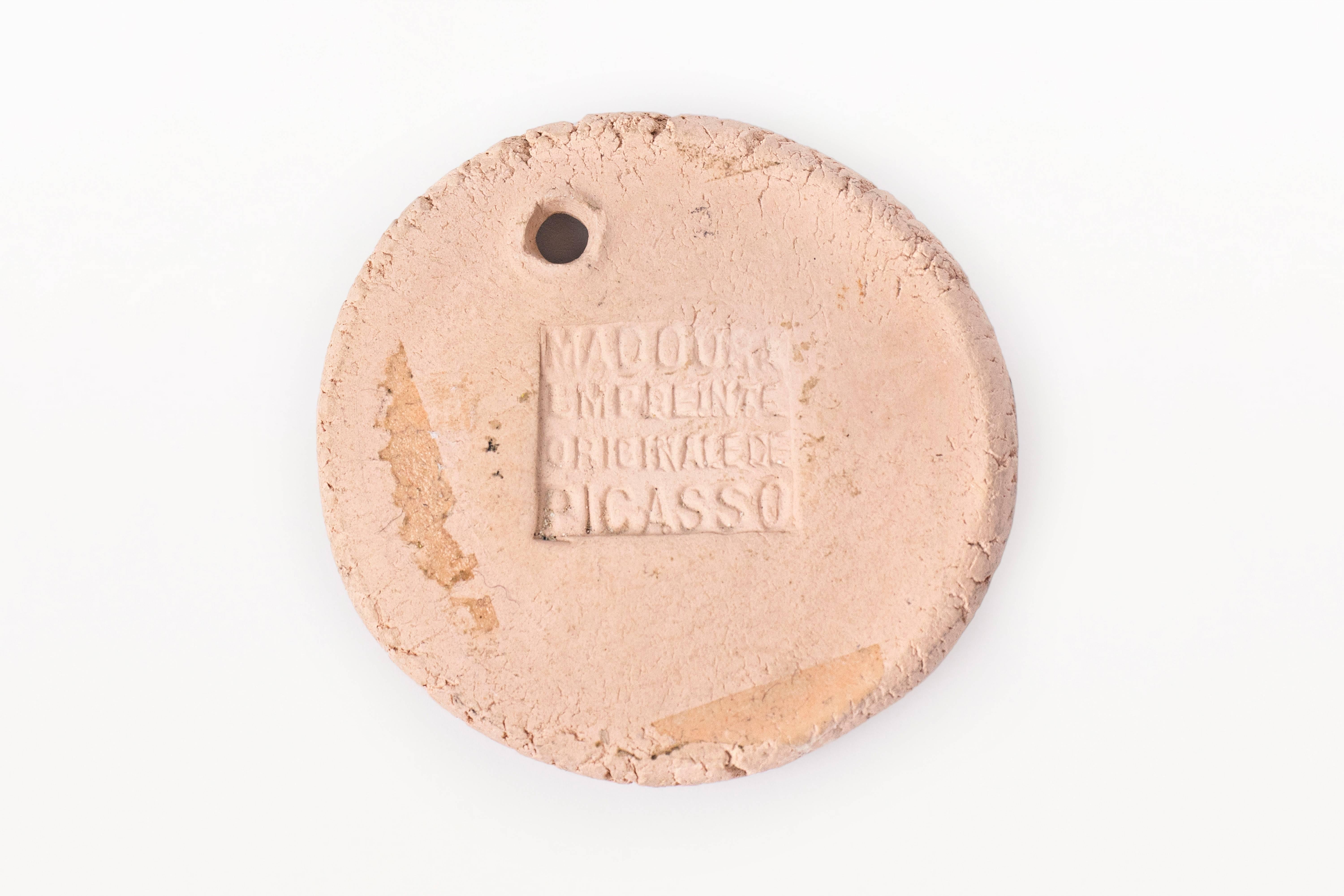 pendentif médaille en céramique 