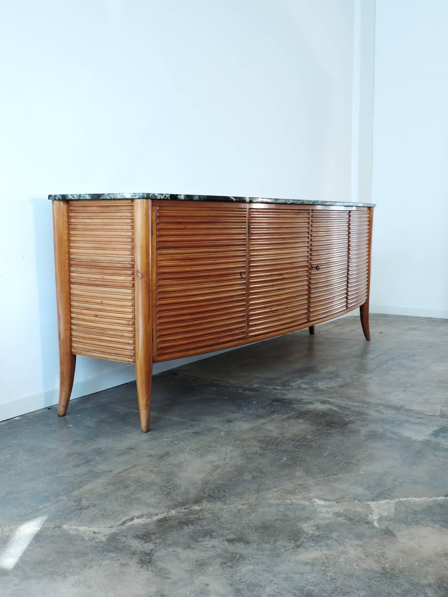 A splendid Mario Quarti curved credenza, marble top.