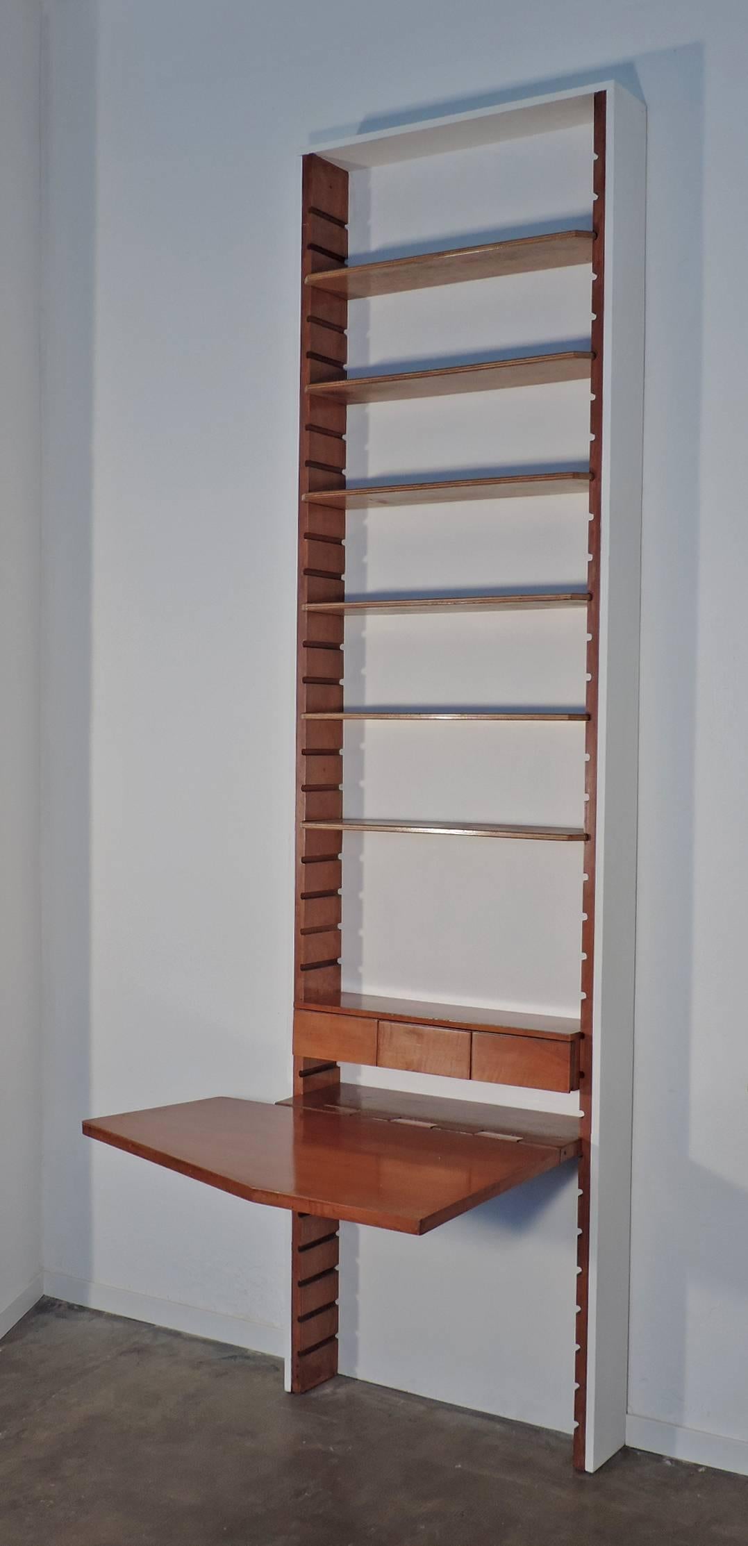 A Unique library by BBPR with a folding desk and movable shelves.
Three drawers.

Commission for Casa R Milan, Italy.

Measurement with desk open 305 x 105 x 87cm.