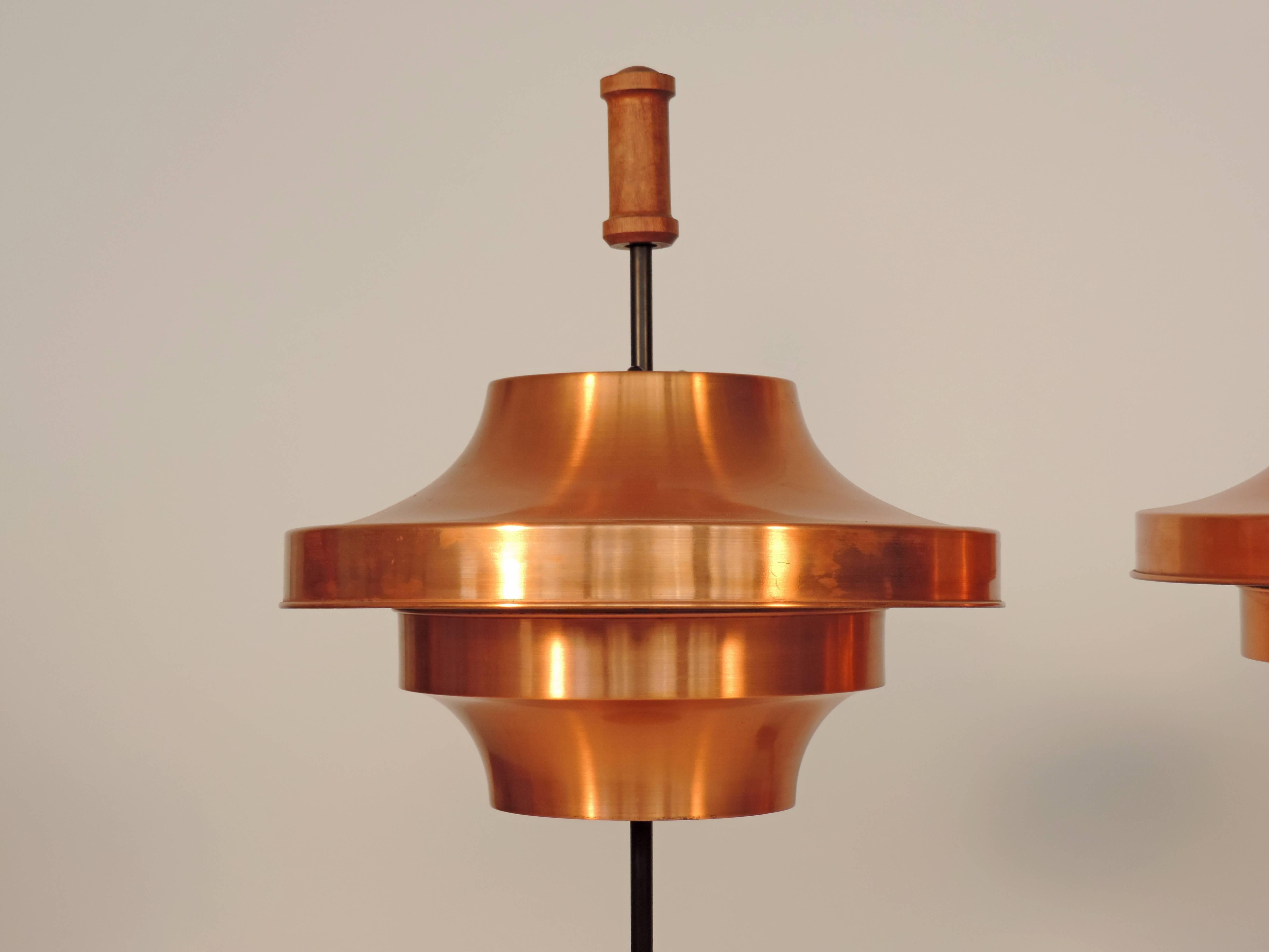 Spectacular and large pair of copper table lamps.