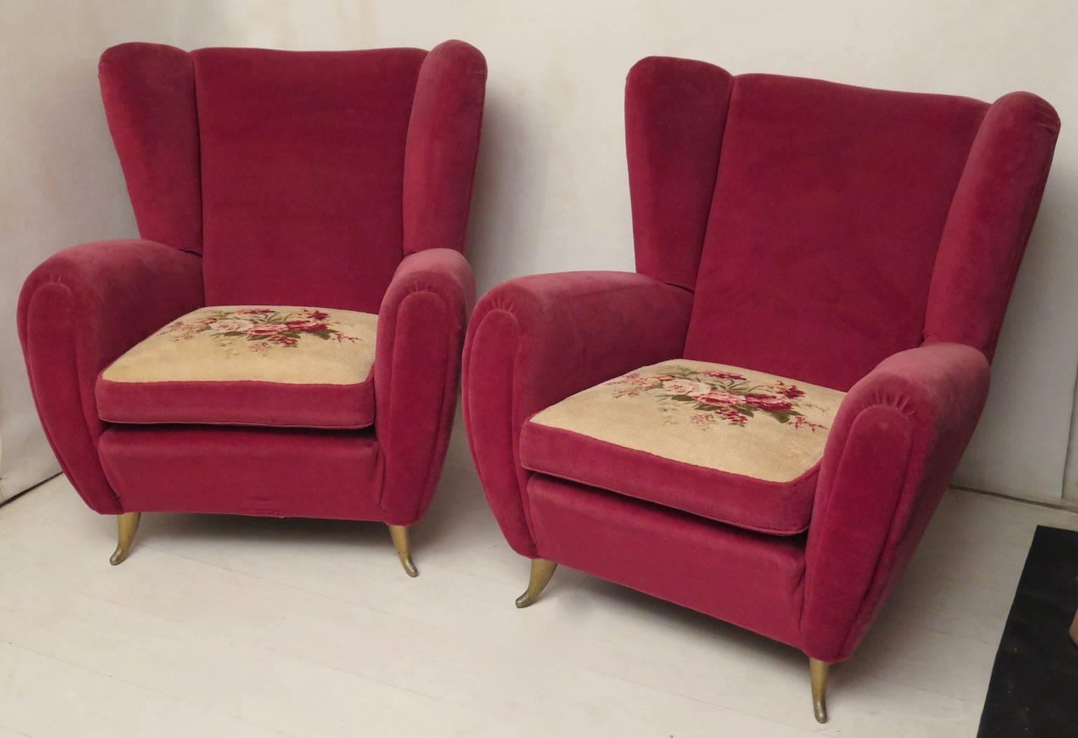 Armchairs of I.S.A. of Bergamo, all in original red / purple fabric, padded wood structure, original fabric all of the time kept in good condition. Brass feet. There is also a sofa that are part of the set.