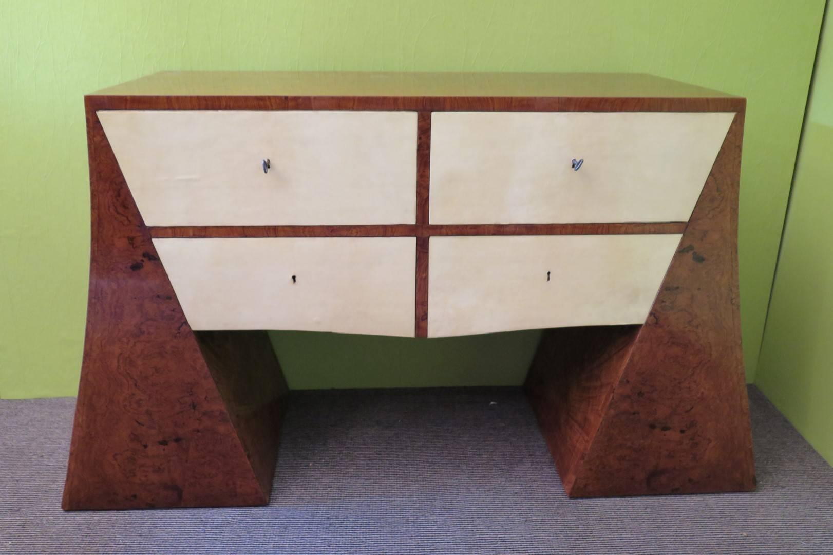 Uniquely designed chest of drawers Art Deco; all veneered wood burl olive, with four drawers covered in parchment.