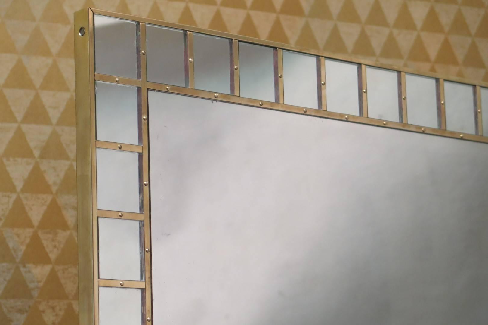Mirror 1950s, with small mirrors which frame and brass finishing.