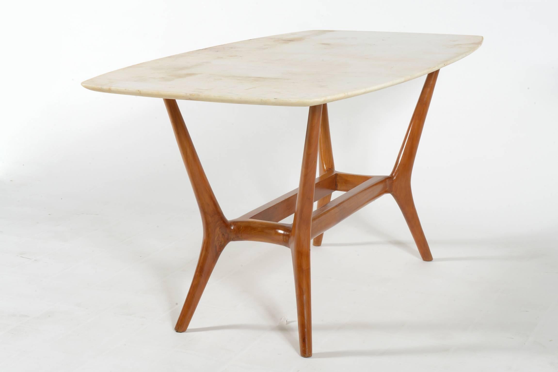 Intersting shaped, slender legs Italian midcentury cherrywood coffee table.
