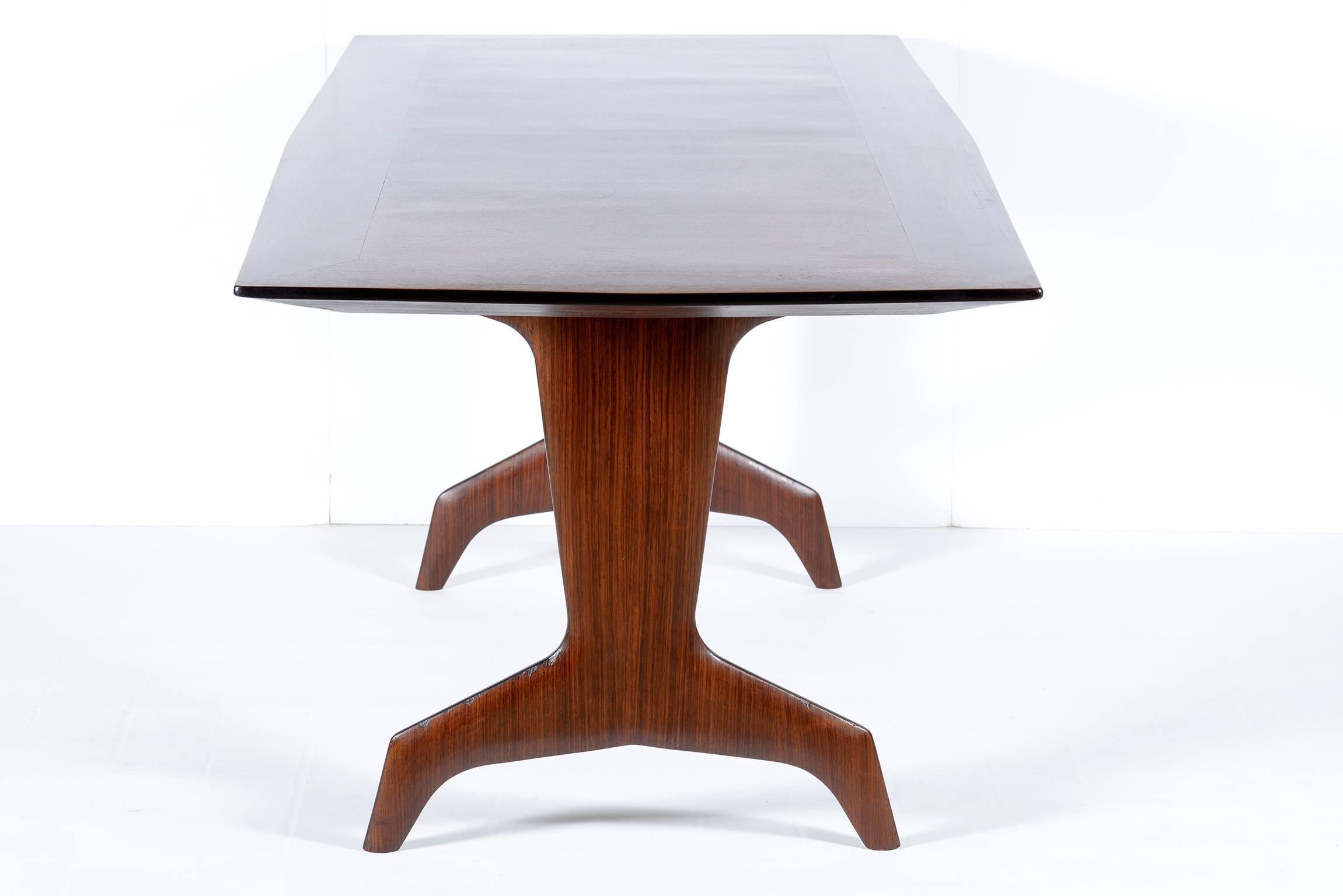 Stylish legs and interesting shaped precious wood  inlaid top for this elegant table that can be used like dining or consolle table or writing desk.