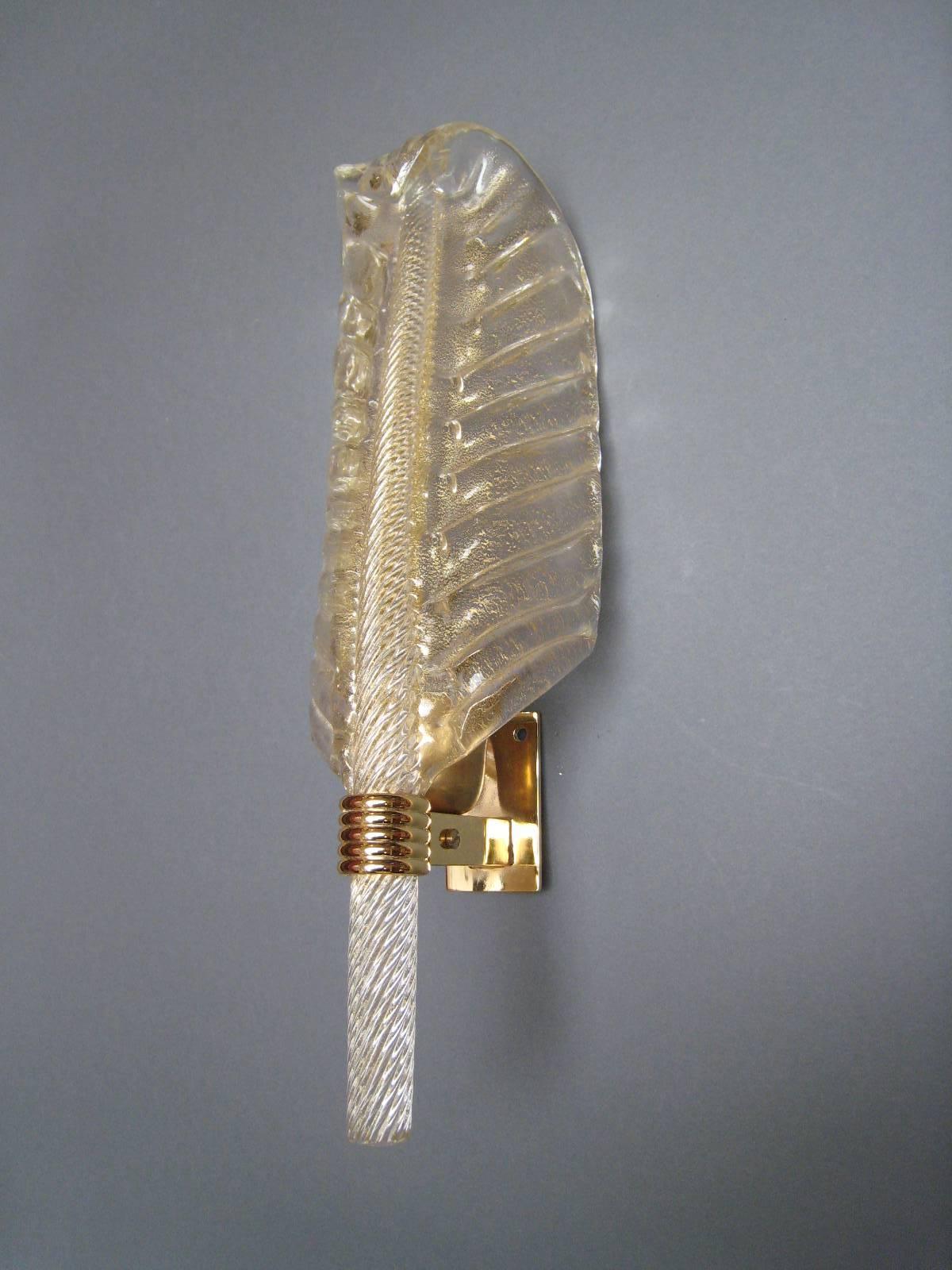 Blown Murano glass with warm gold inside feather shaped , gold brass structure.
Seguso Manufacture.

