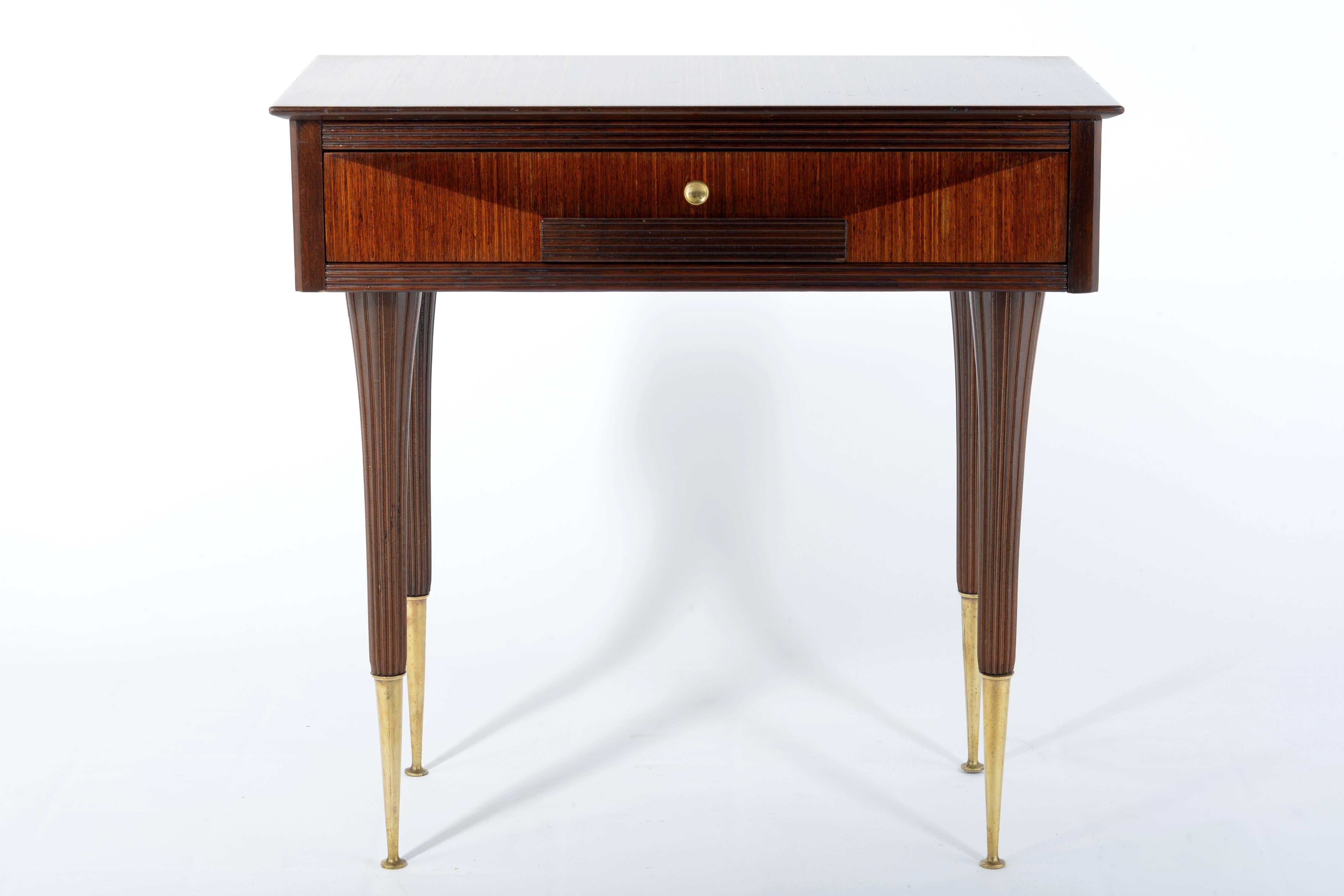 Pair of tables with one drawer, brass slender legs and handels.