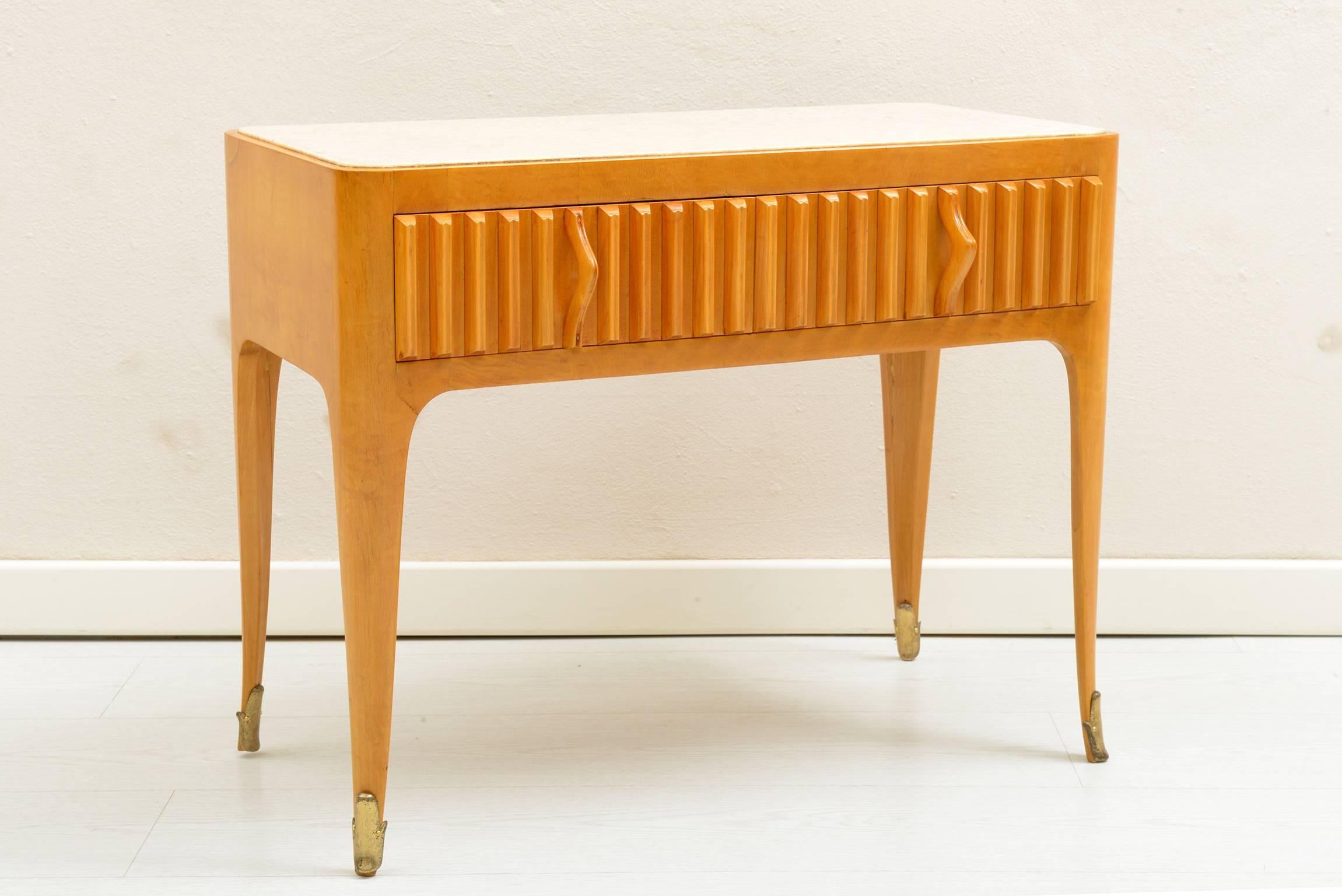 Solid maples structure with slender elegant legs, two fluted drawers in the front with beautiful sculptured and curved solid maples handles.
Brass details in the feet.
Top encased marble.