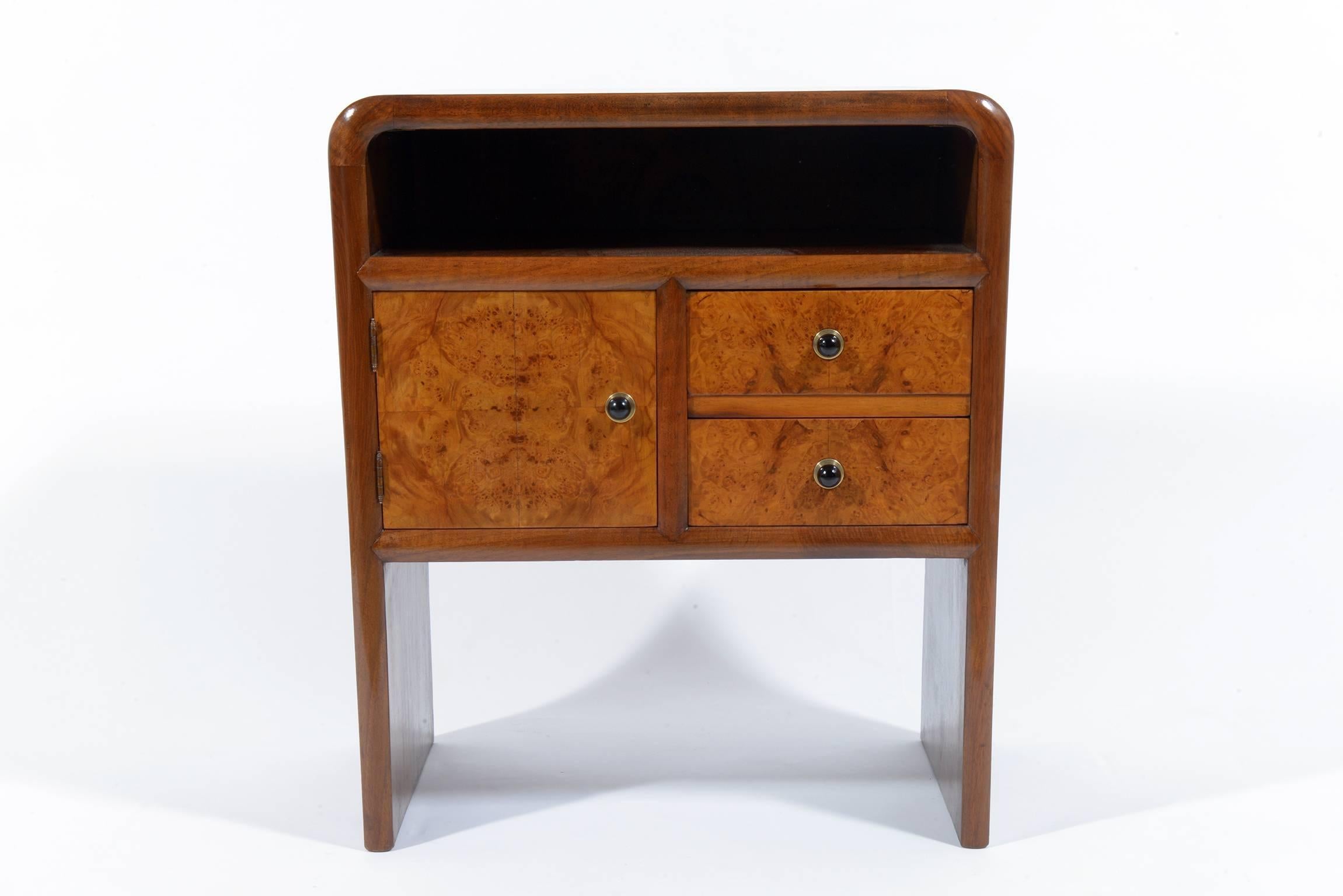Pair of exotic wood and maples burl nightstand or side table two drawer and one door. Bakelite handles with brass details.
A space under the top to put books or magazine.
Price is for two.
Italia, 1930.
  