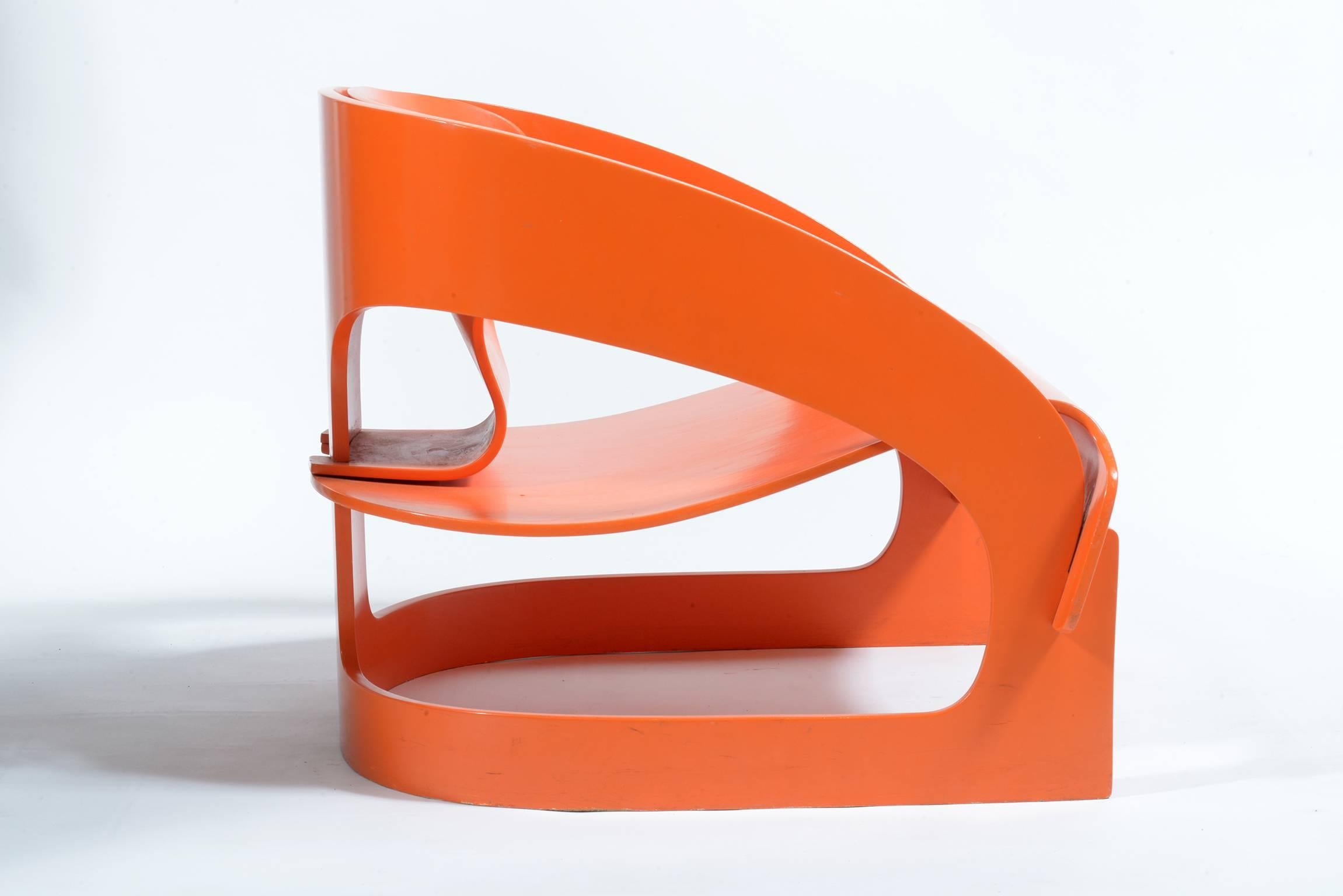 Curved wrapped playwood original orange lacquered. This icon of the Italian Mid-Century was designed by Joe Colombo in the 1964 and produced by Kartell.