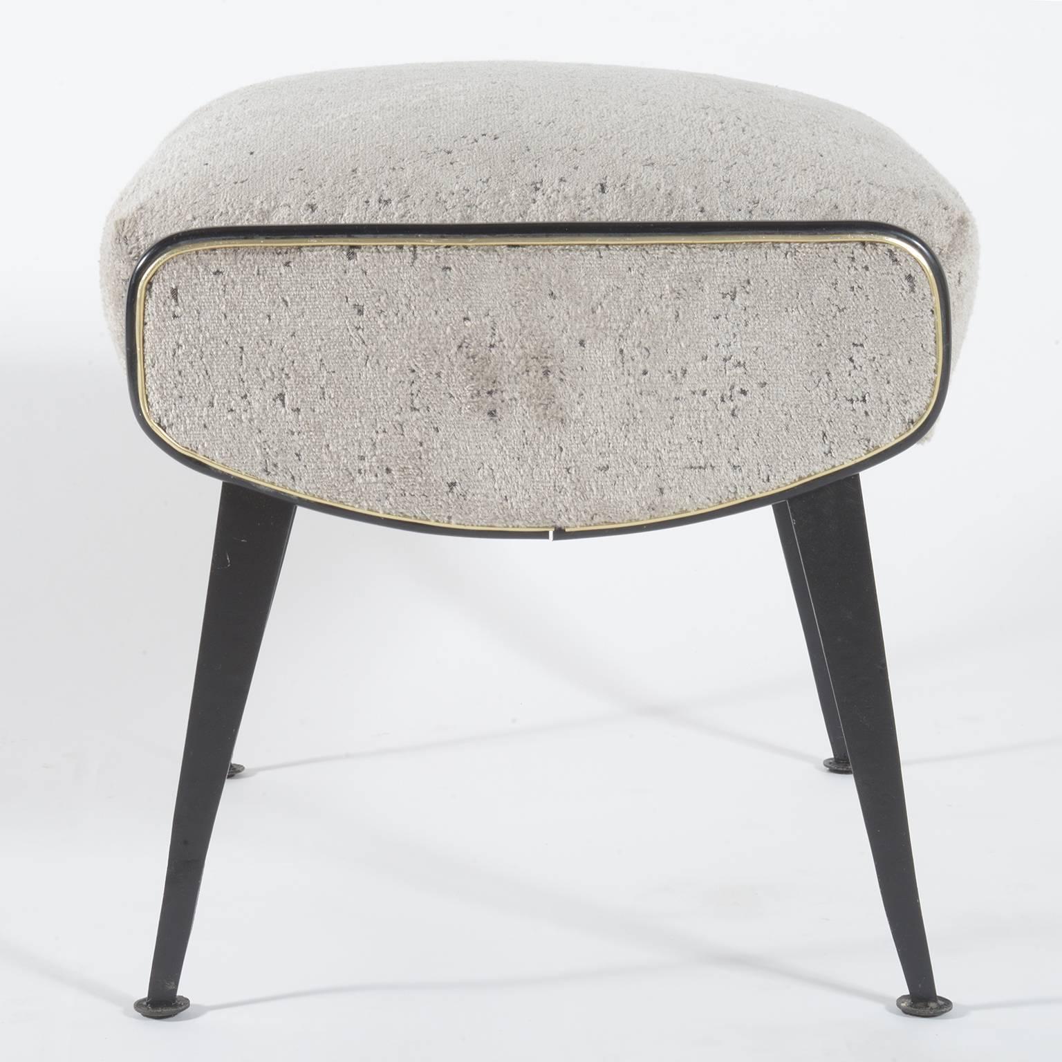 Pair of Italian, 1950s stools with slender black metal legs. The seats are newly covered with velvet fabric keeping the original trimmings details in black and silver.