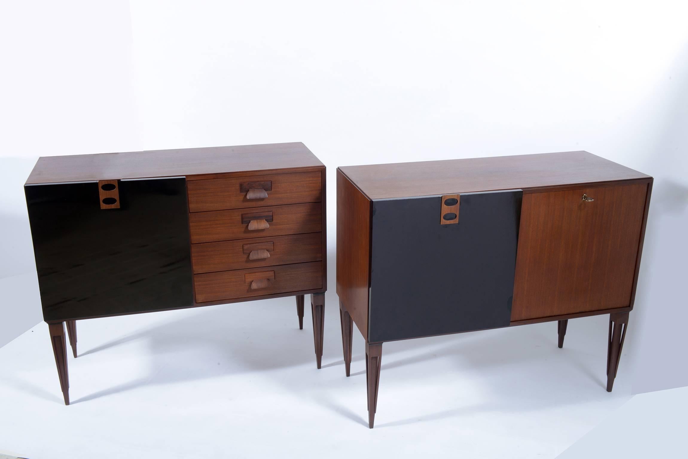 High quality of construction.
Teak wood structures and black lacquered doors.
Signed with fire mark by F.lli Proserpio, circa 1960.
One cabinet has on the left a door with shelve inside and on the right four drawers with beautiful sculptured