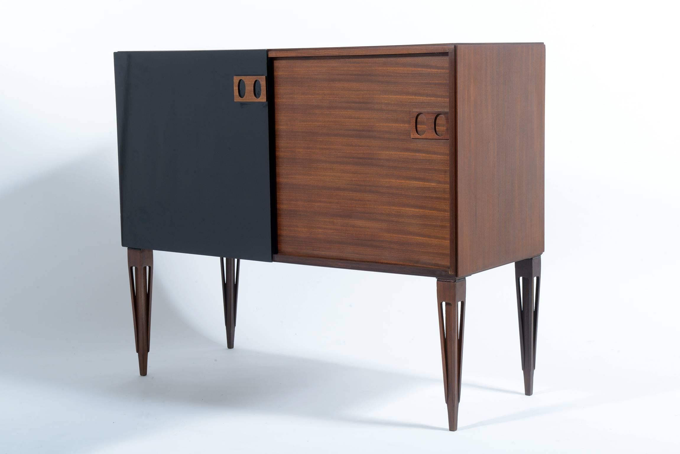High quality of construction.
Teak wood structures and black lacquered doors.
Signed with Fire Mark by F.lli Proserpio, circa 1960.
Two sliding doors each cabinet with teak shelve inside.
Solid teak sculptured stylish legs.
The cabinets are