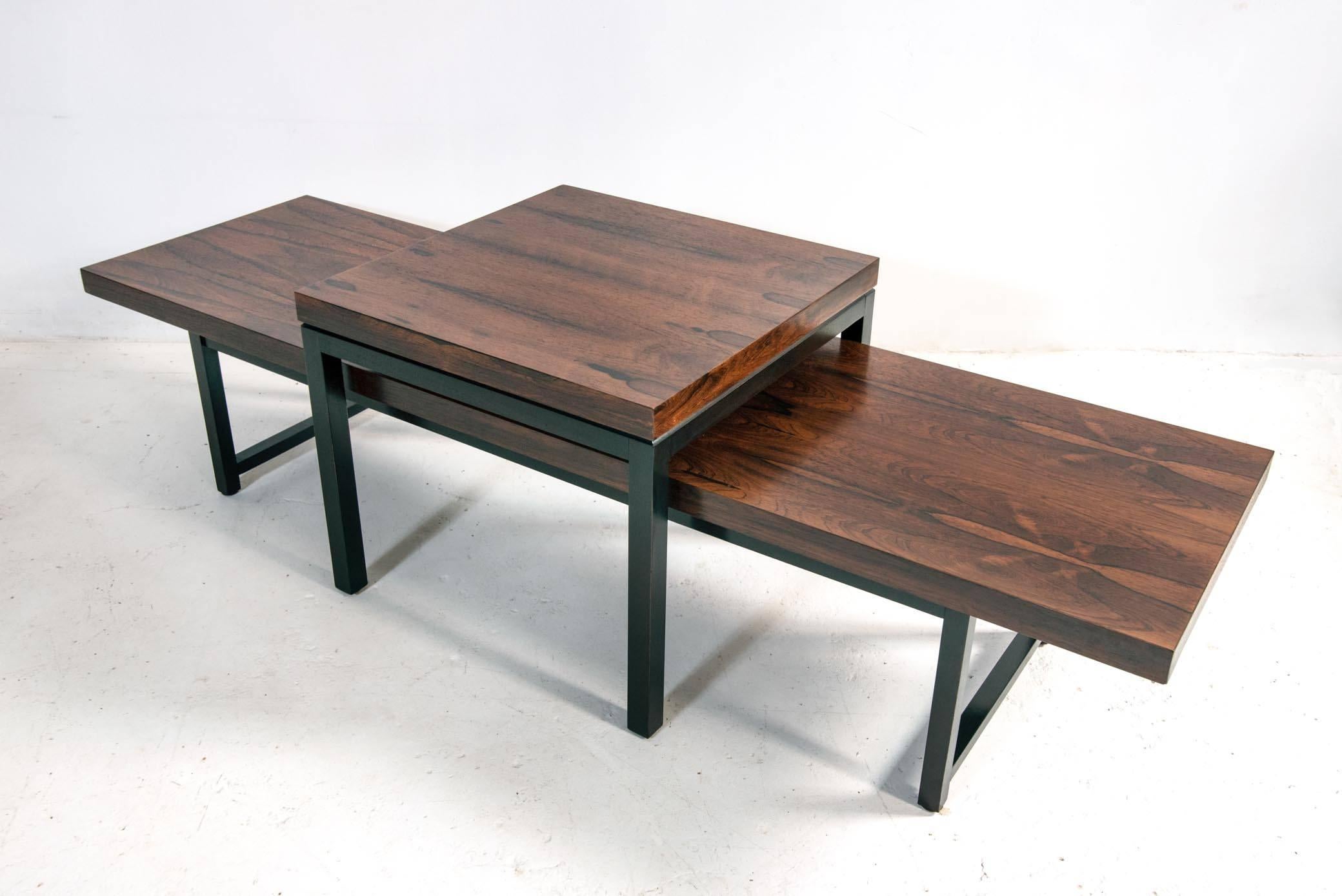 An elegant coffee or cocktail table designed by Milo Baughman for Thayer Coggin, circa 1960. Featuring a beautifully grained rosewood top supported by an architectural base in black lacquer. Recently refinished and in excellent vintage