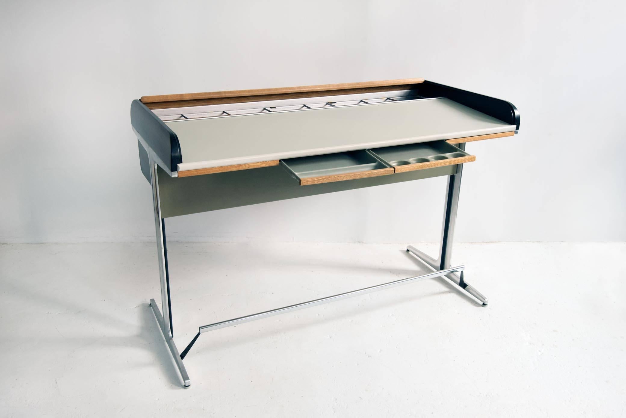A high, roll-top desk from the Action Office or No. 649 Series designed by George Nelson & Robert Propst for Herman Miller, circa 1964-1968. Featuring an ash tambour top that opens up to reveal a large laminate working surface with designated