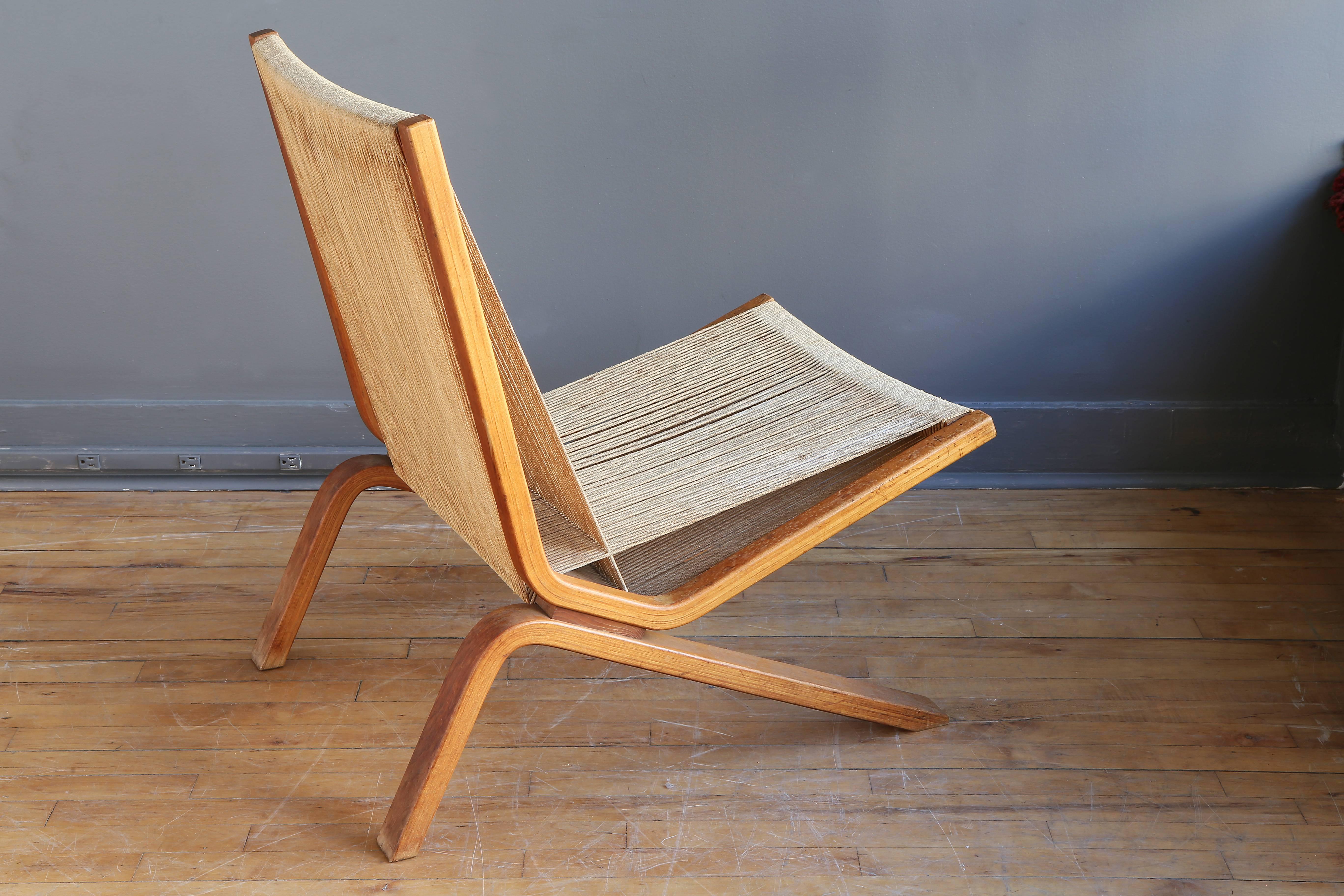 A rare lounge chair designed by Allan Gould, circa 1952. Featuring a birch frame with string seat and back. 

An interesting combination of materials representative of Post-War design. 

In nice vintage condition with a warm patina. 

Please