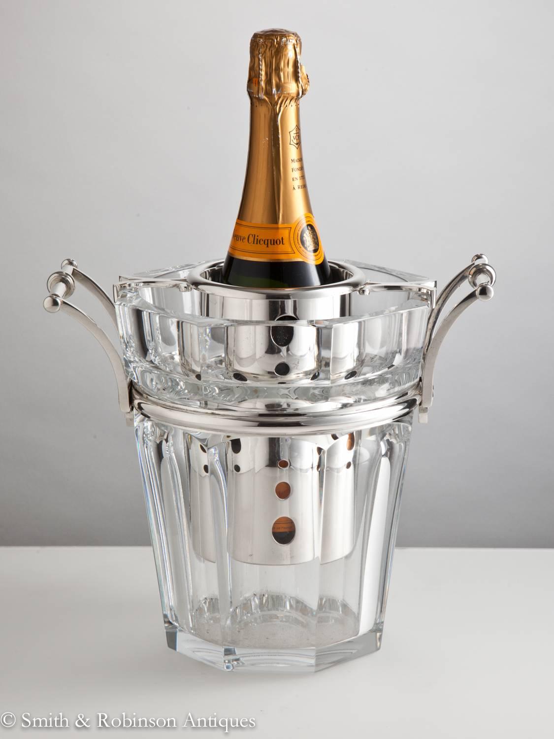 Time for a celebration!
A very impressive centrepiece Baccarat champagne cooler.
The quality of the thick glass body and metal work is stunning. It is in perfect condition and complete with all original components as shown.
Makers mark stamped on