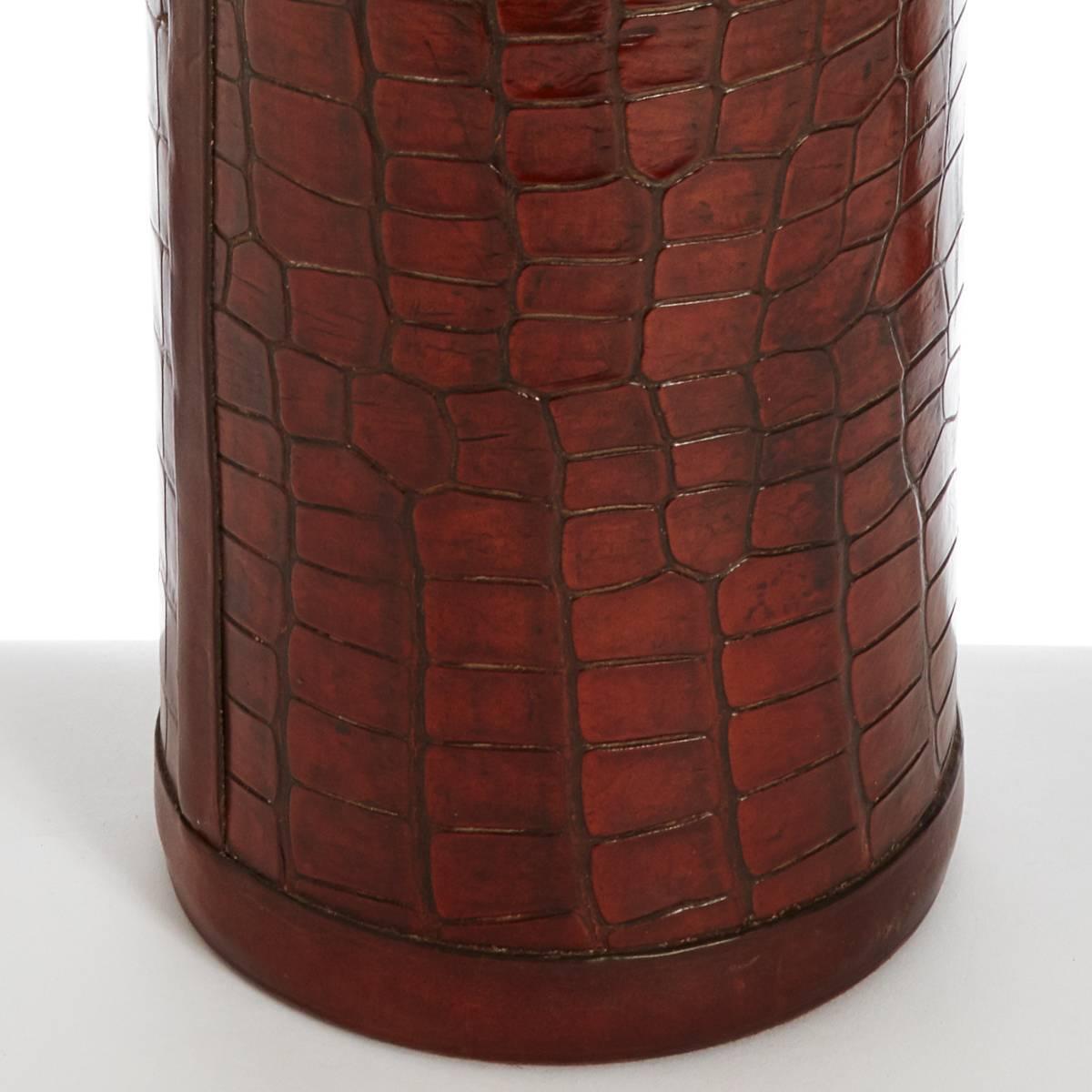 A vintage crocodile walking stick display stand.
Robust crocodile exterior with plain leather trim to both the upper and lower rim, the interior has been relined with heavy duty grey fabric.

Please note that this listing is for the stand alone