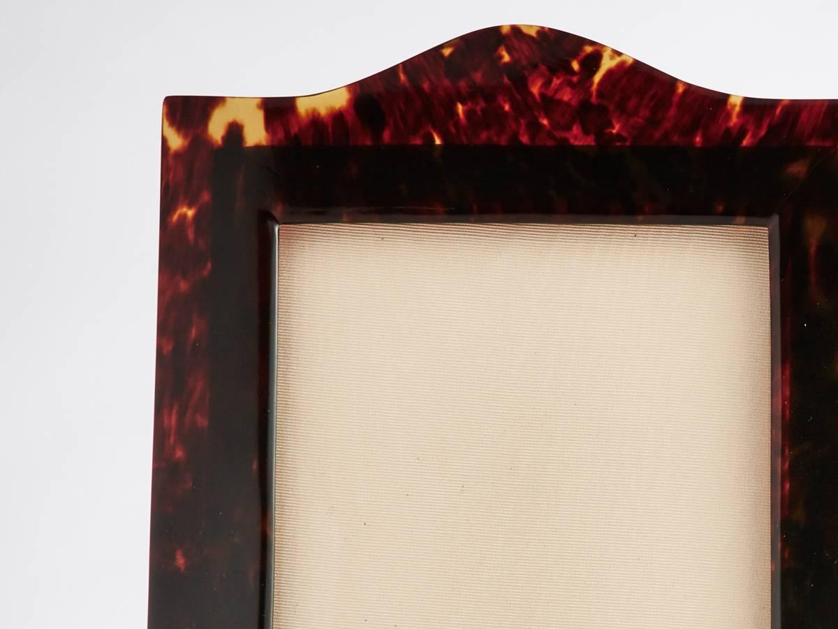 A pair of arch top elongated tortoiseshell photograph frames. 

There is a good patina on the shell of both, which is always enhanced by lighting to give them an attractive mellow glow.  

Measures: Height 10 1/2