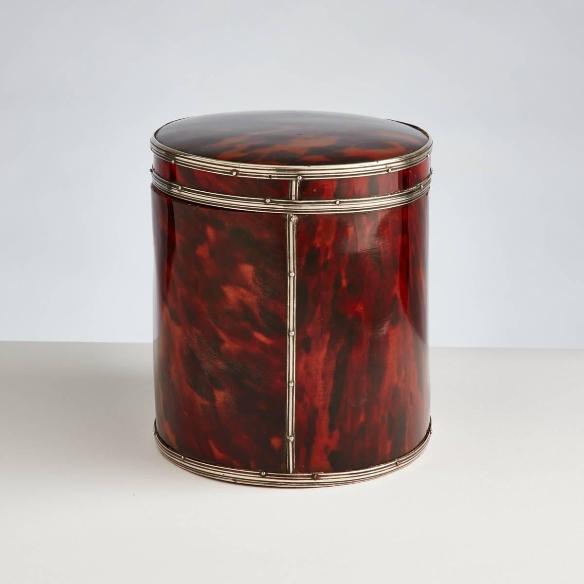 The shell has a beautiful mellow patina and the silver binding to both the lid and body on both sides enhances this piece.

The interior retains its original lining throughout.
  