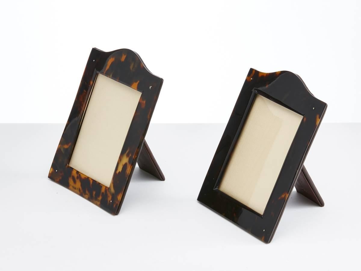 Pair of antique tortoiseshell picture frames with arch top date circa 1910-1915

These frames are in very good condition with a attractive patina of the tortoiseshell.

 The backs are in soft brown leather.

Cites license required if purchased