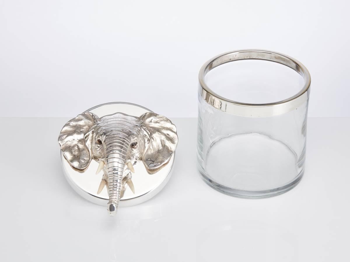 Elephant Mask Handle Novelty Ice Bucket Austria Circa 1930.

A stunning Austrian 20th century novelty ice bucket, with an elephant mask handle as the lifting function. The elephant head has been intricately crafted and the glass eyes are a beautiful