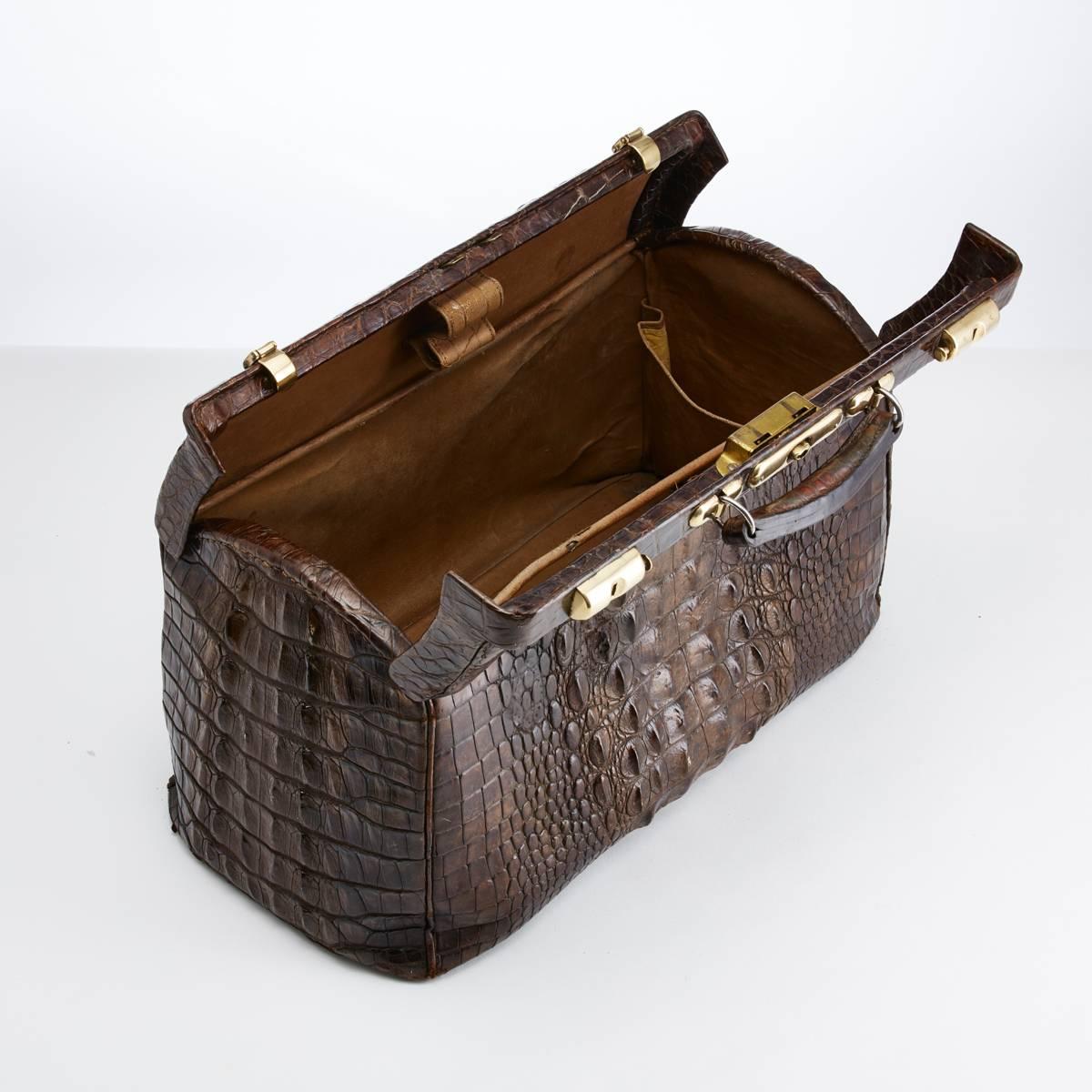 Large early 20th century crocodile gladstone bag,

circa 1910-1915.

This rugged piece of crocodile luggage with raised centre skin is in excellent condition both on the exterior and interior. It was likely to have originally been a customised