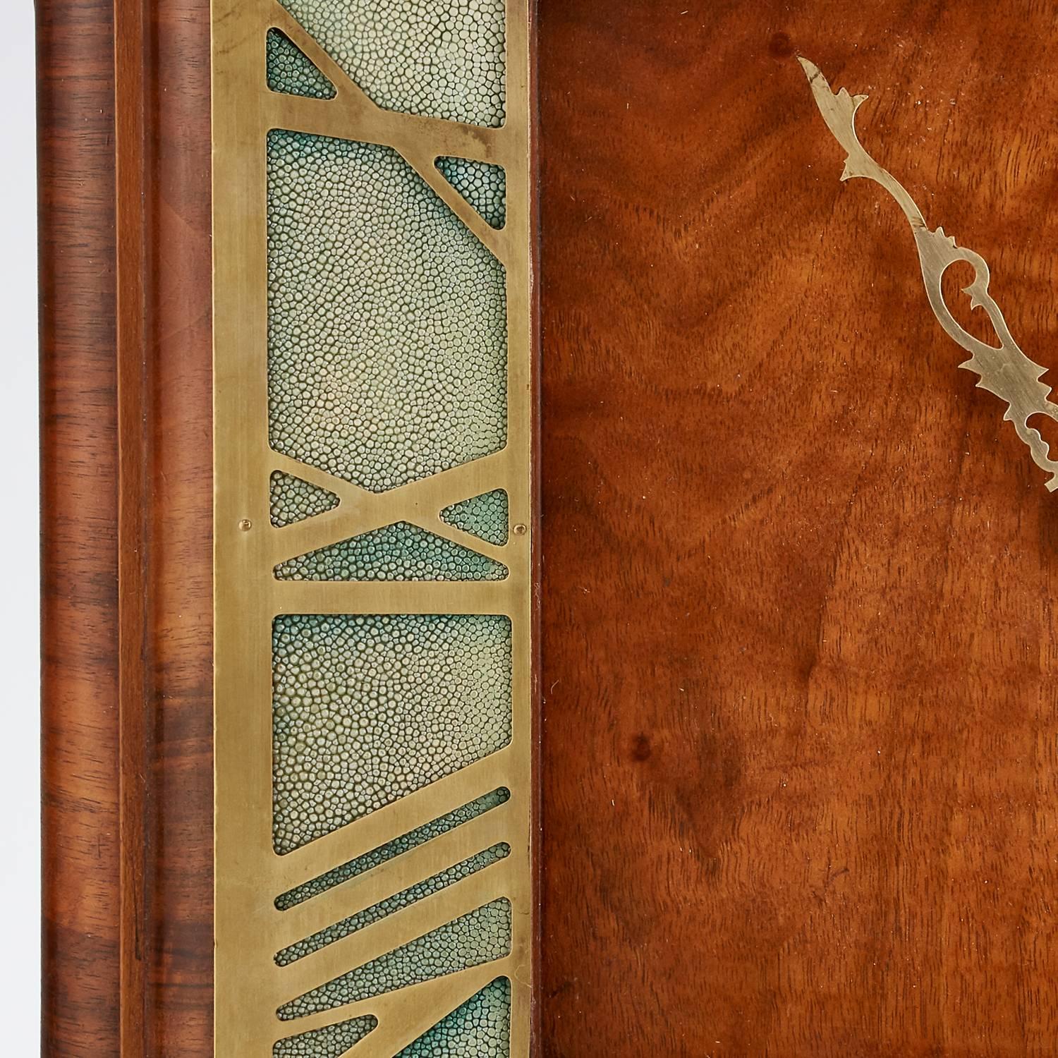 20th century large Art Deco, walnut veneered wall clock with a shagreen border and roman numeral dial, date circa 1930 origin English

The metal work is brass & the movement is electric.
  