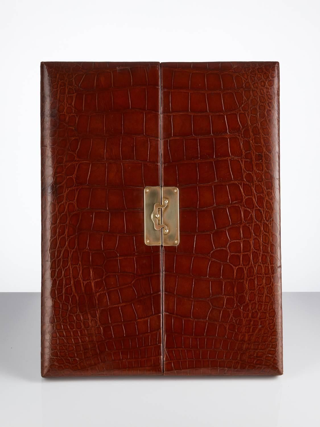 Large early 20th century folding crocodile photograph frame, circa 1920
This piece is in excellent condition and the crocodile retains its original patina.
When opened it appears unused as both leather and silk are in perfect condition.
Also