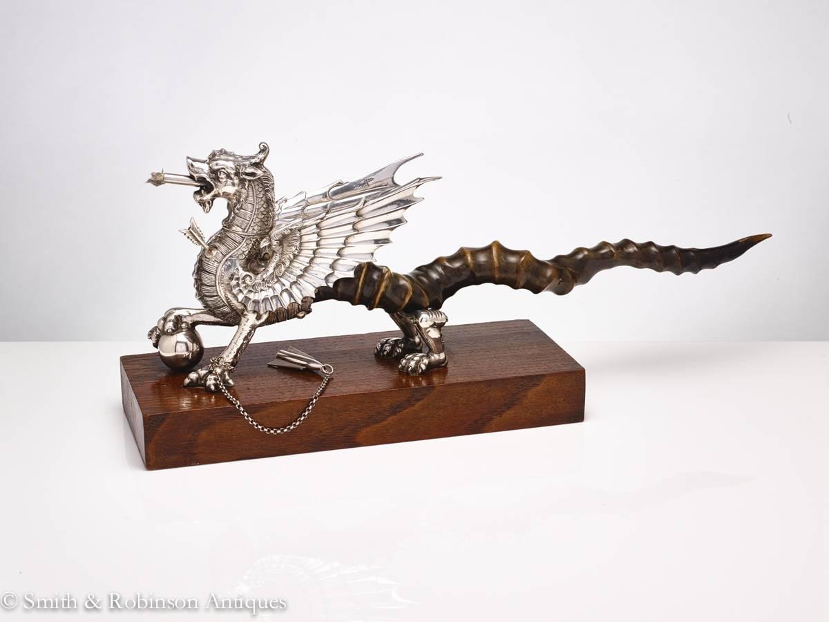 The head has a turning motion which allows it be turned towards the seated person on either side of a dining, or occasional table.

The body has a tamper stick inserted in the upper body in the form of an arrow & also a snuffer on a chain as