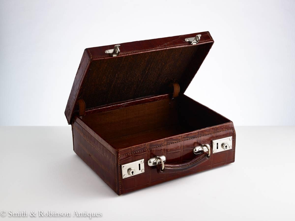 A very smart small attaché case from a bygone era.

This piece is in practically unused condition, the skin still has its original sheen.
The handle is very strong and the metal work is all in good condition with no scratches. 
Also the interior